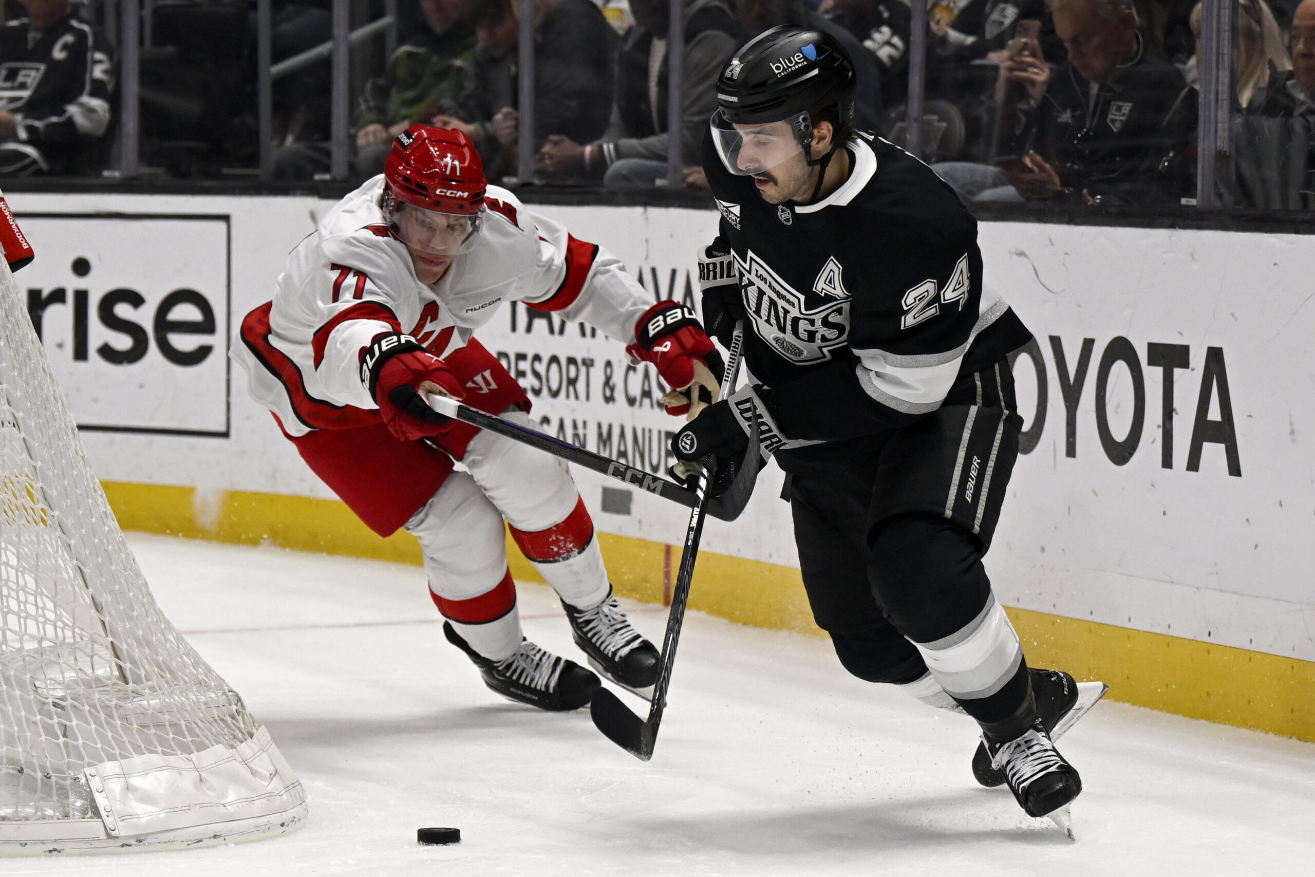 Kings center Phillip Danault (24) controls the puck while under...