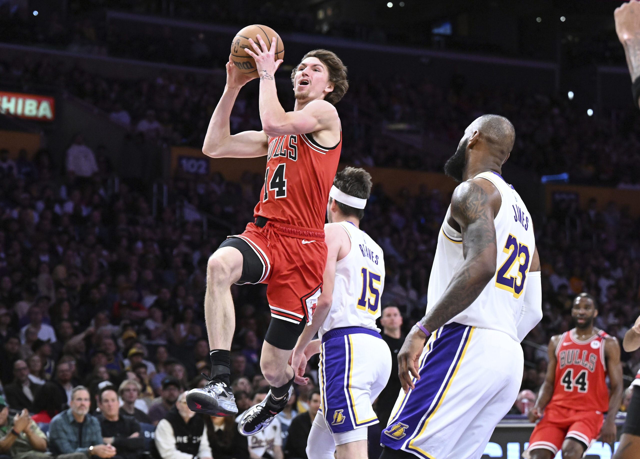 Chicago Bulls forward Matas Buzelis (14) scores a basket in...