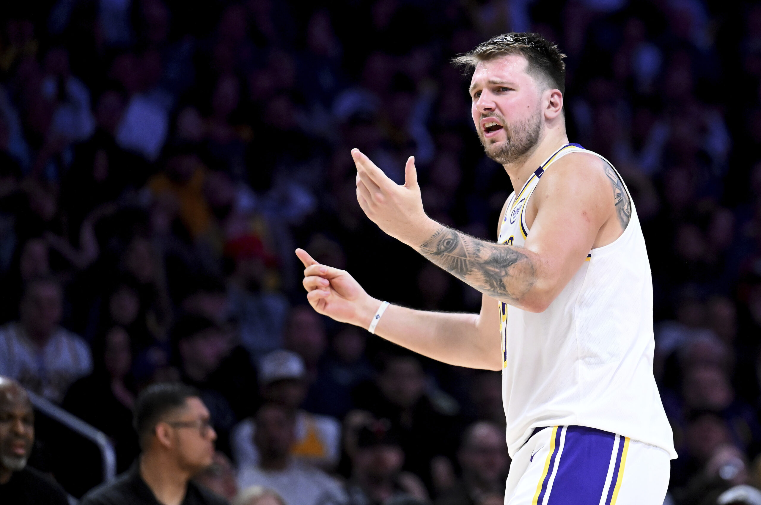 Lakers guard Luka Doncic (77) reacts against the Chicago Bulls...