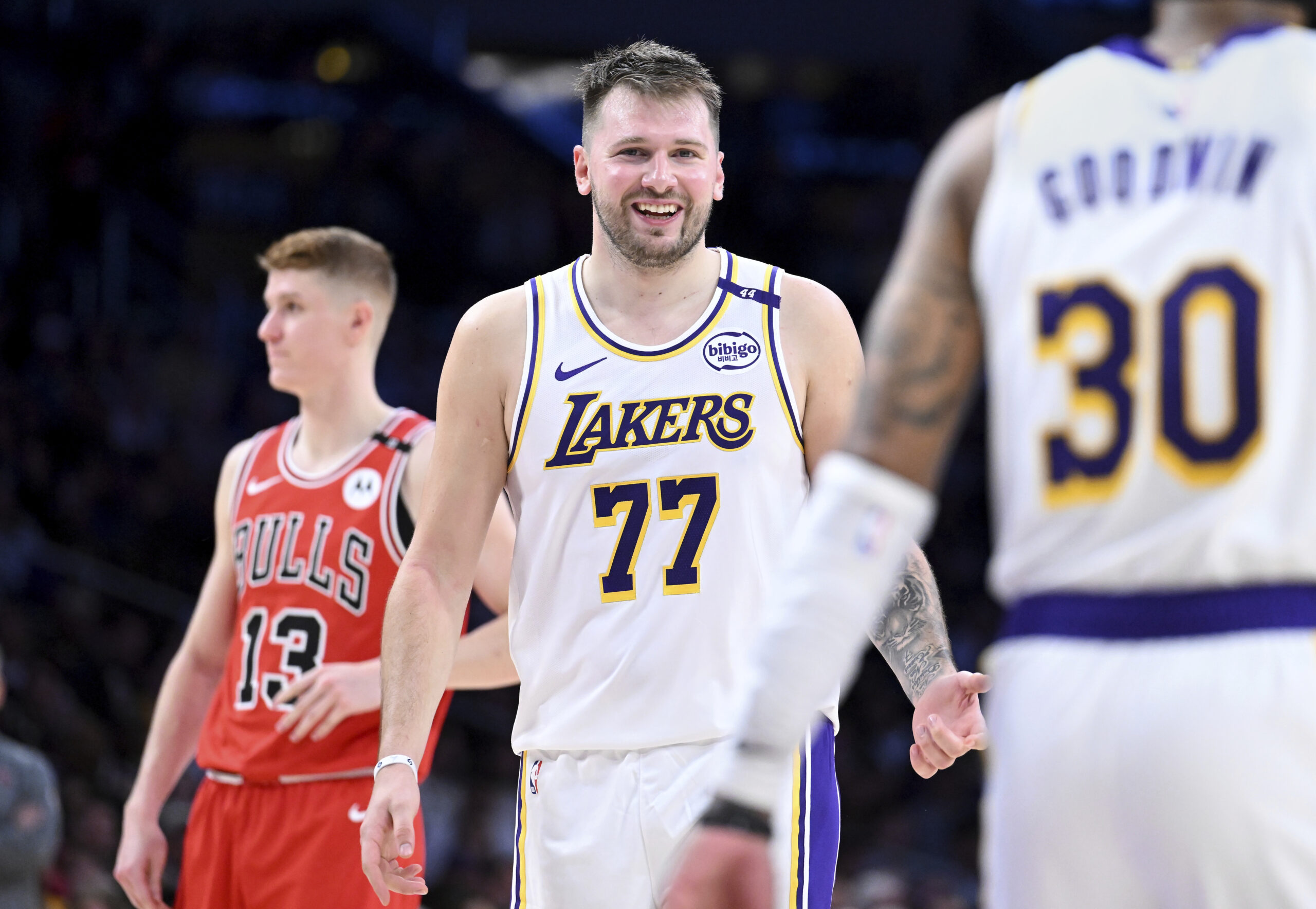 Lakers guard Luka Doncic (77) smiles after making a basket...