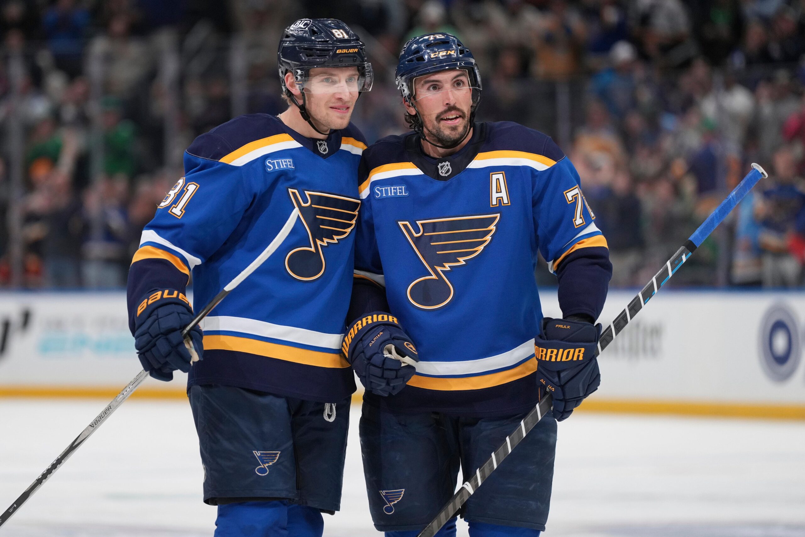 St. Louis Blues’ Dylan Holloway, left, is congratulated by teammate...