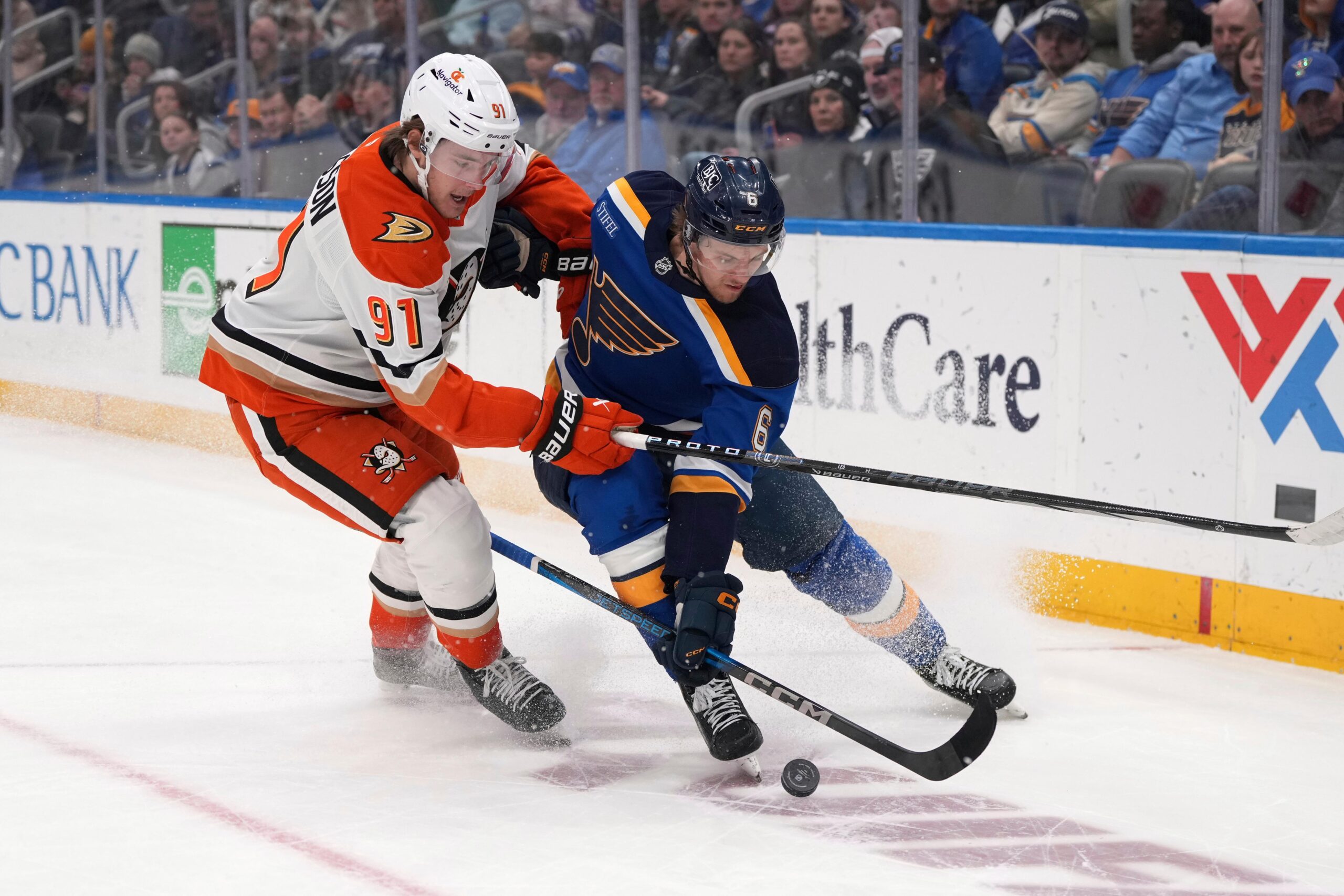 Ducks’ Leo Carlsson (91) and St. Louis Blues’ Philip Broberg...