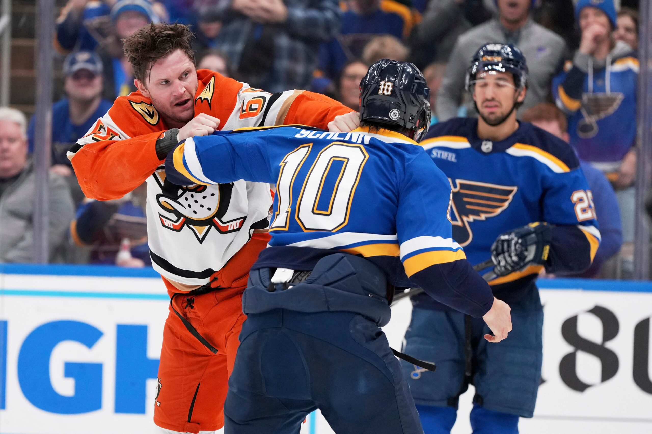 Ducks’ Jacob Trouba, left, and St. Louis Blues’ Brayden Schenn...