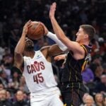 Phoenix Suns guard Collin Gillespie (12) guards Cleveland Cavaliers guard Donovan Mitchell (45)