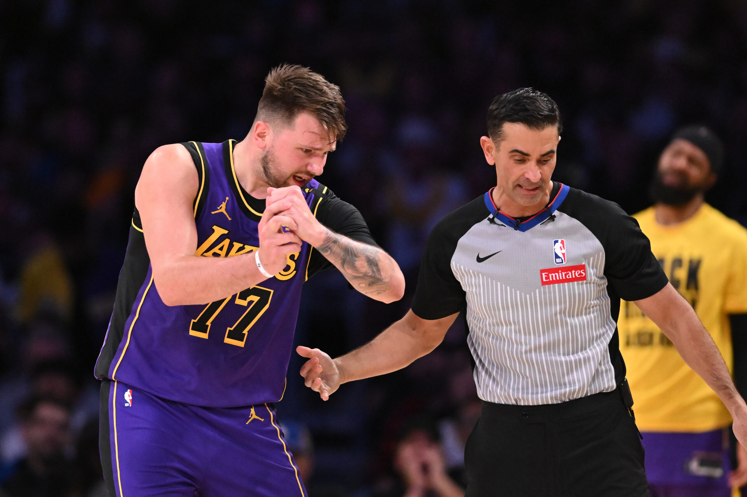 Lakers star Luka Doncic argues a foul call with one...