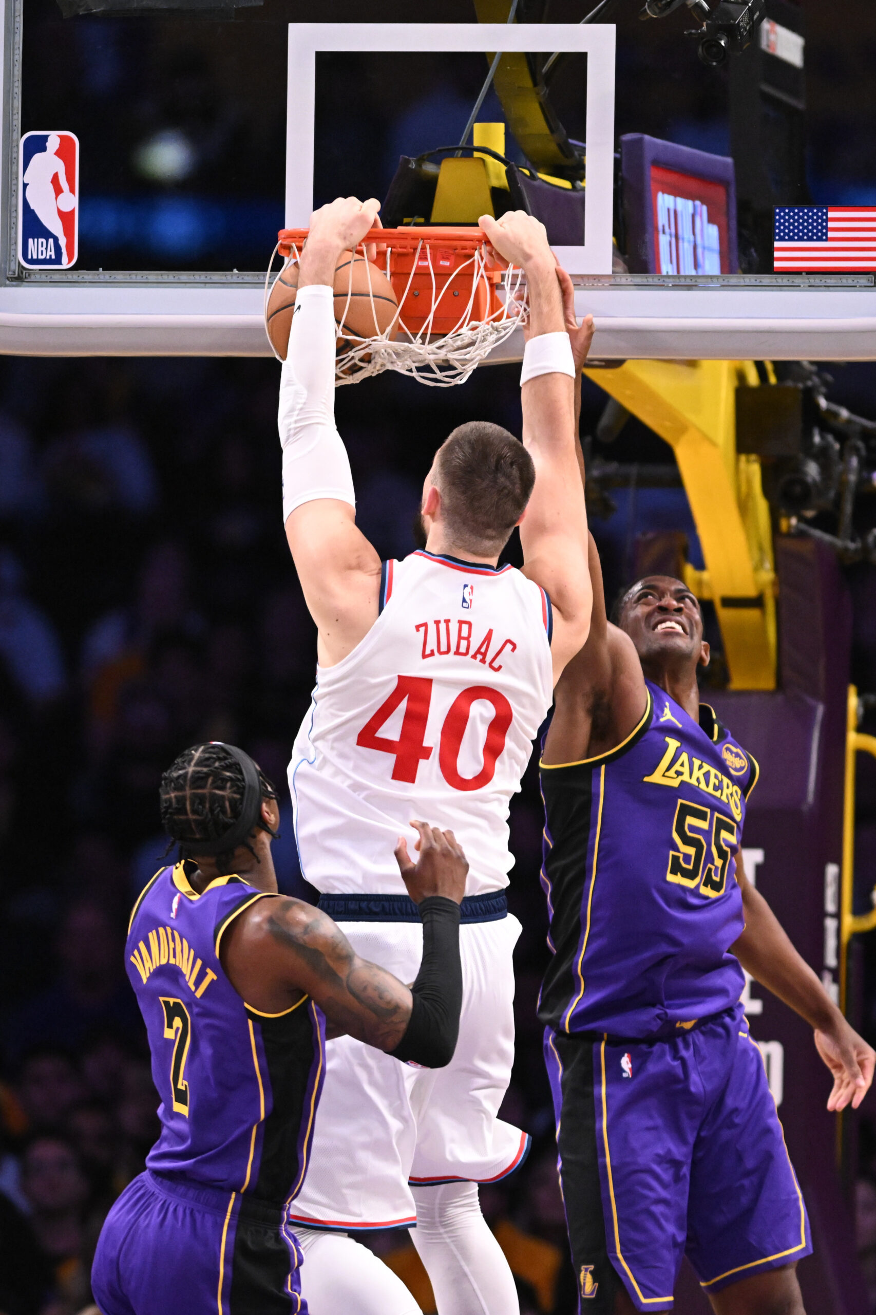 Clippers center Ivica Zubac dunks as Lakers forward Jarred Vanderbilt,...