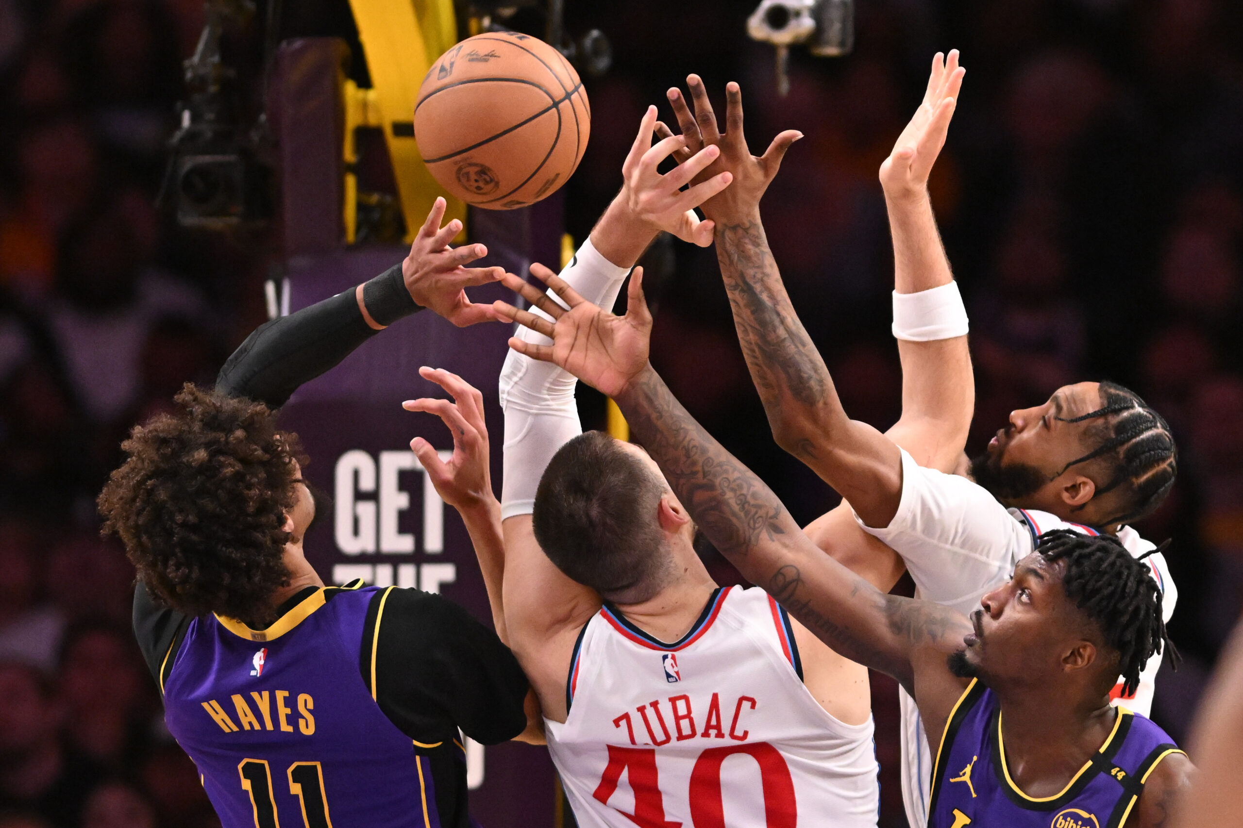 Lakers center Jaxson Hayes, left, and teammate Dorian Finney-Smith, bottom...