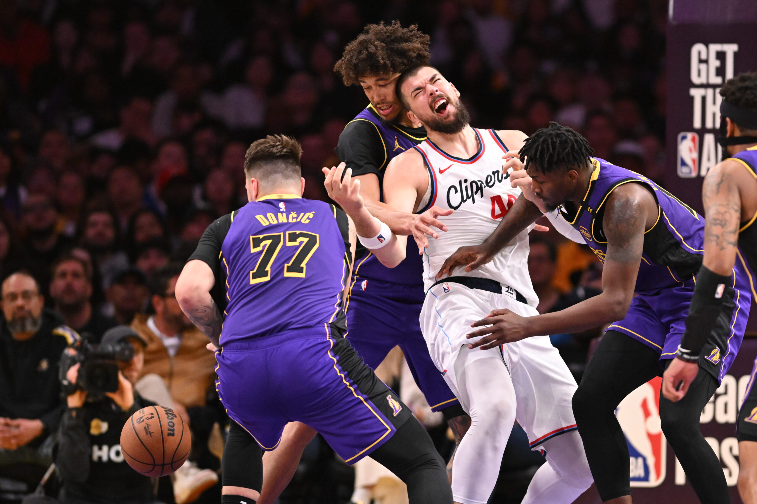 Lakers star Luka Doncic (77), center Jaxson Hayes, top left,...