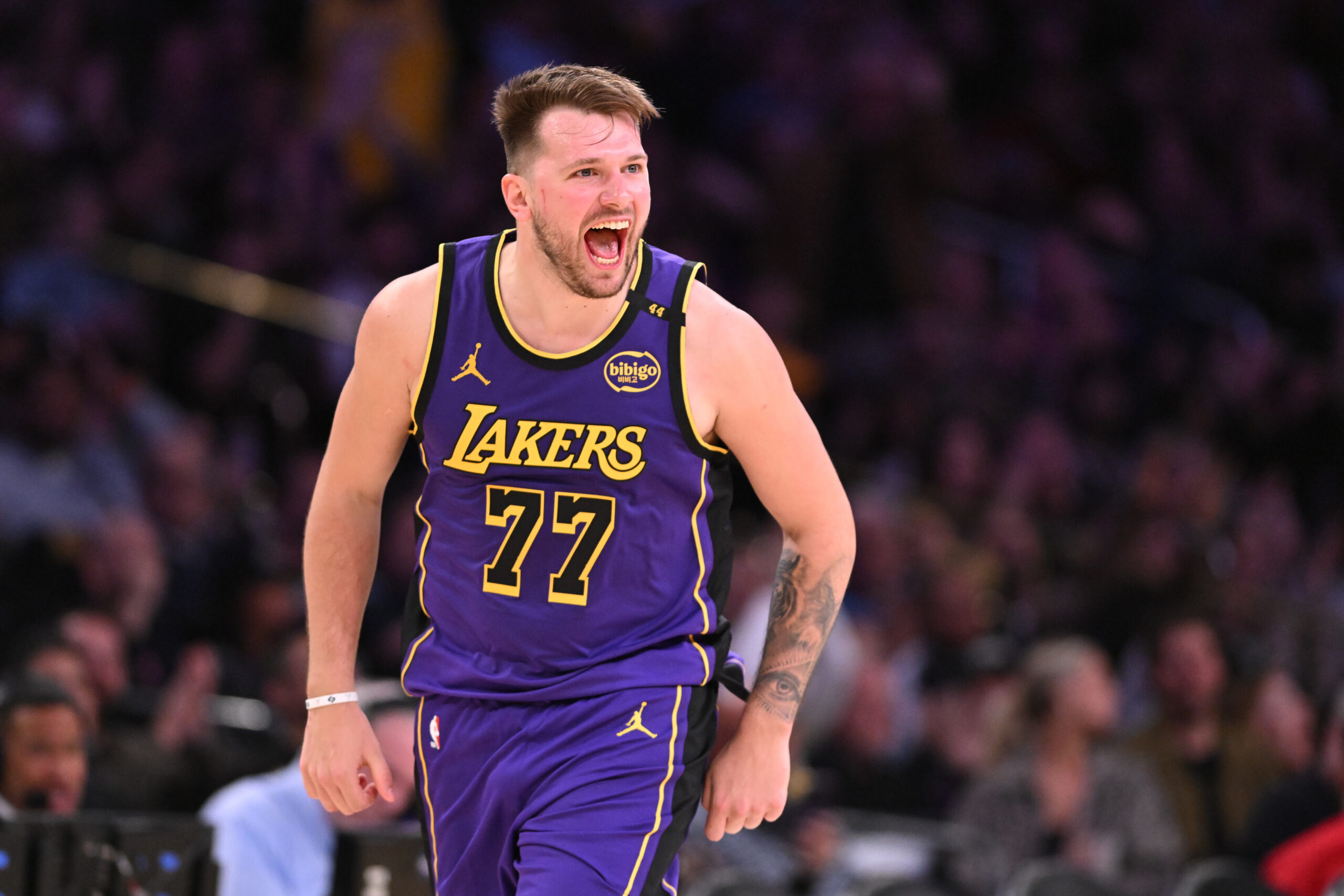 Lakers star Luka Doncic celebrates after making a pair of...