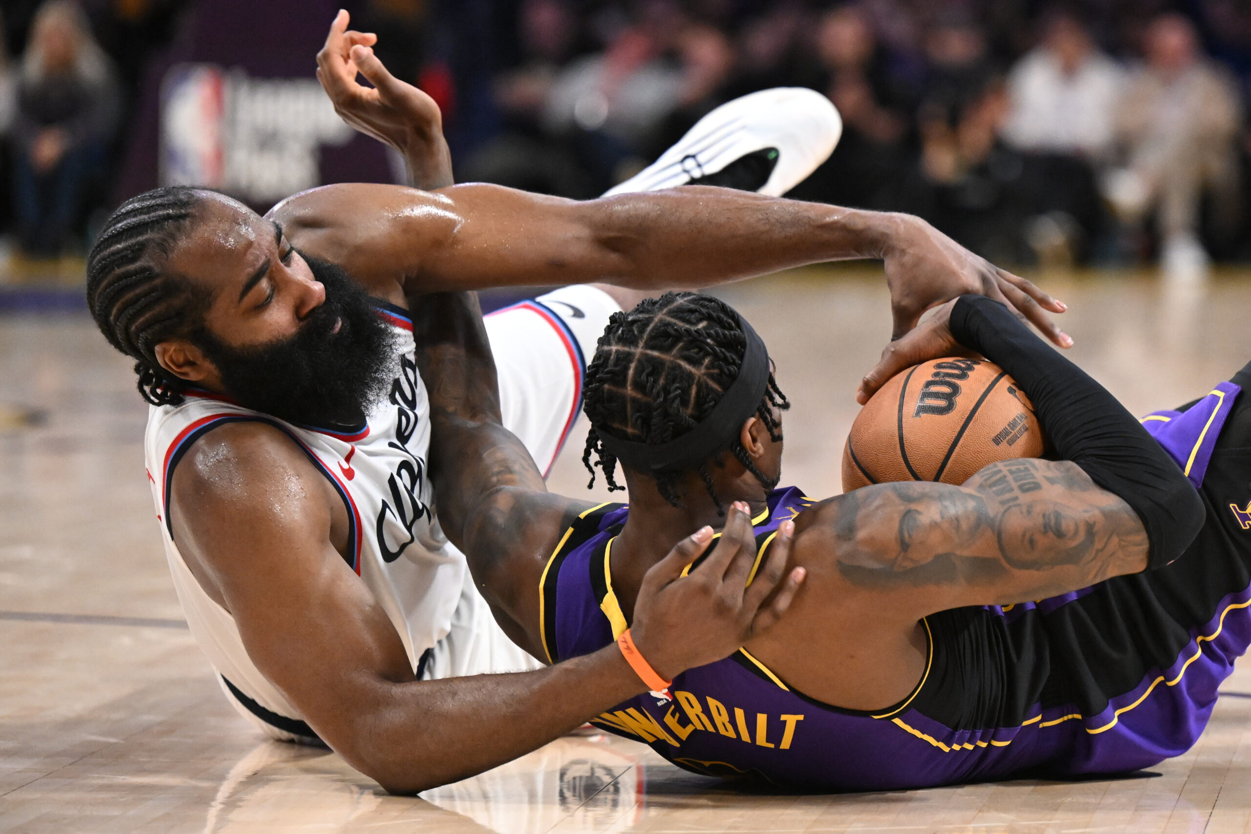 Clippers star James Harden, left, and Lakers forward Jarred Vanderbilt...