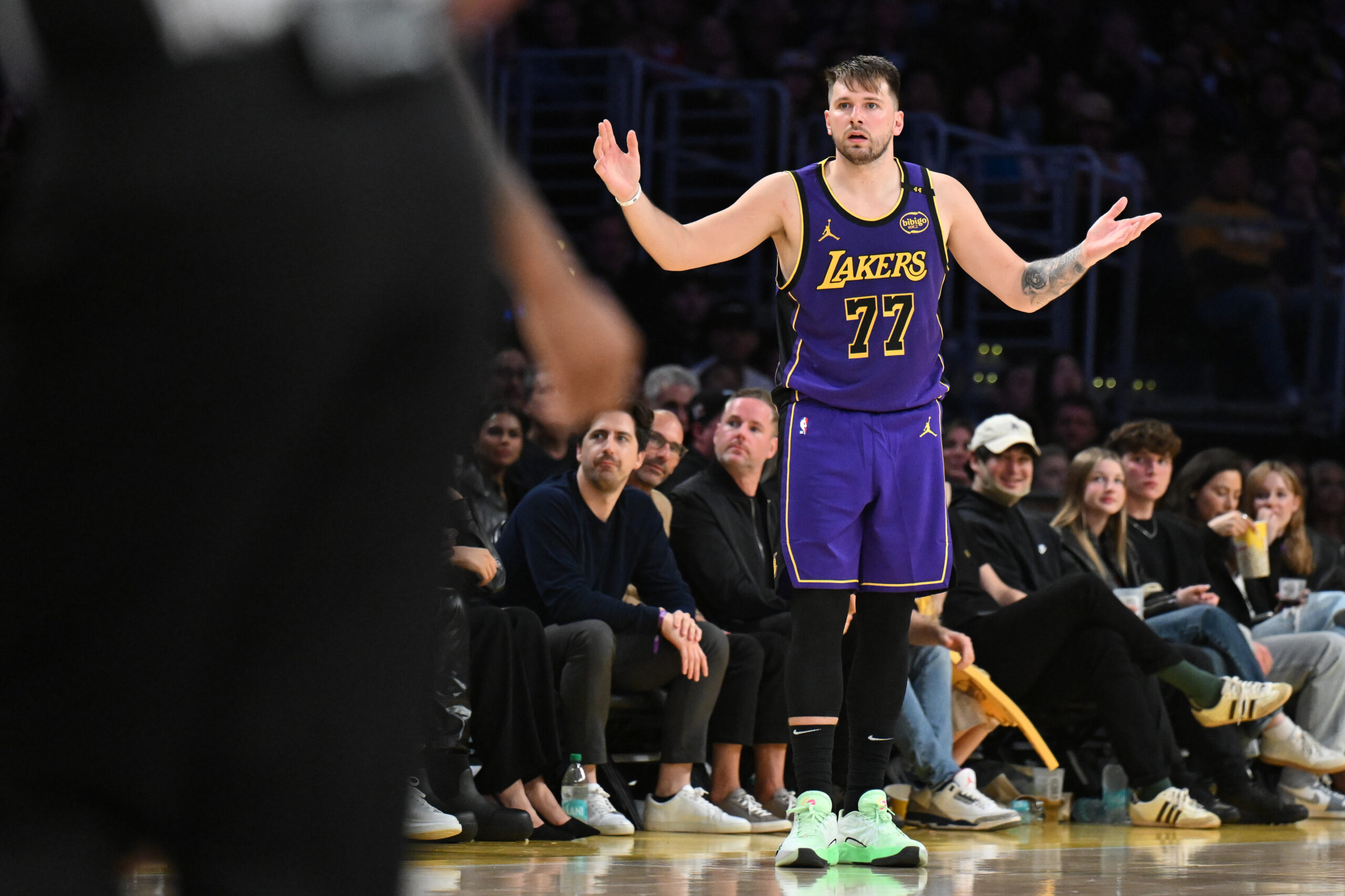 Lakers star Luka Doncic gestures after being called for his...