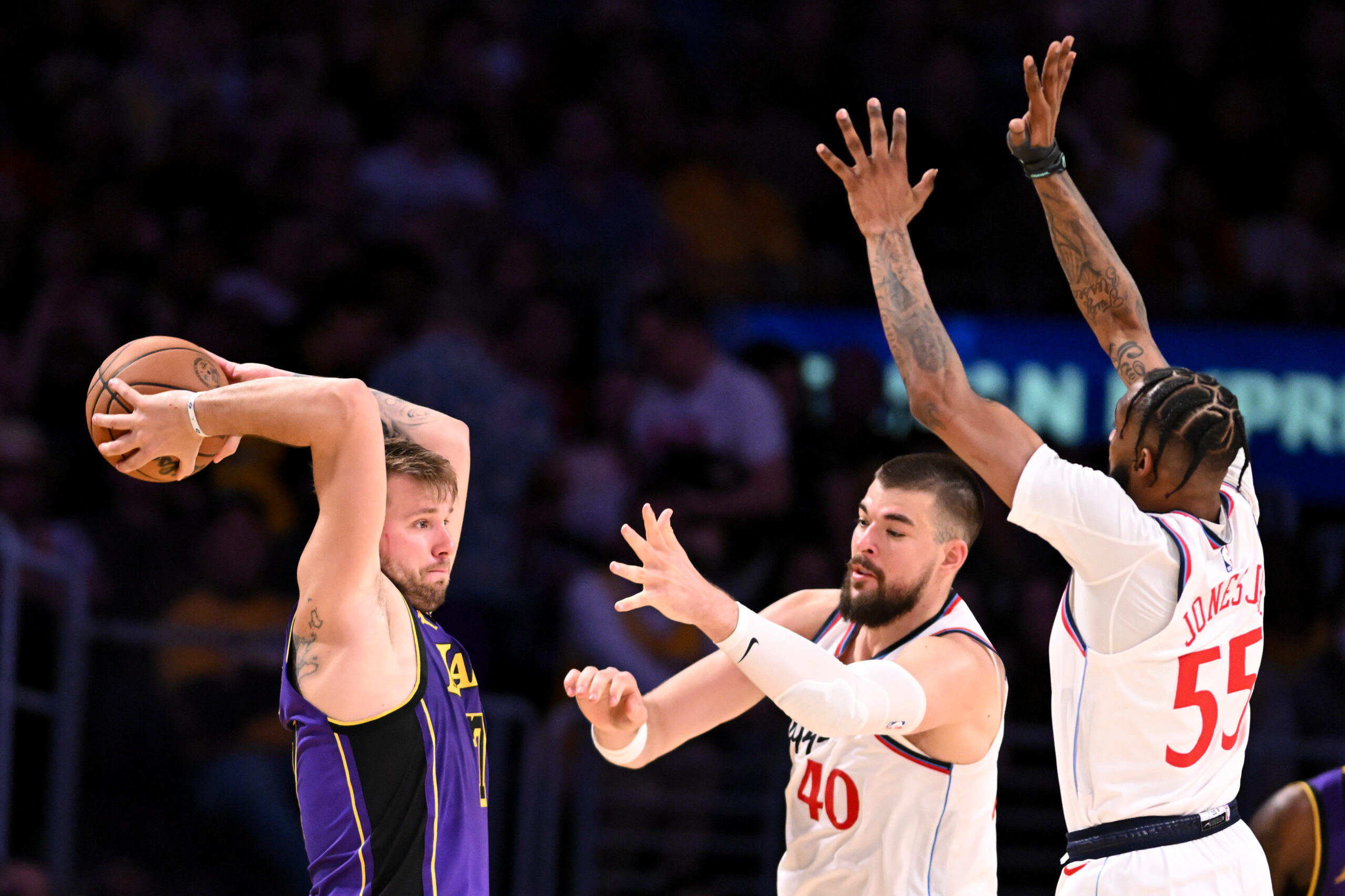 Lakers star Luka Doncic looks to pass the ball around...