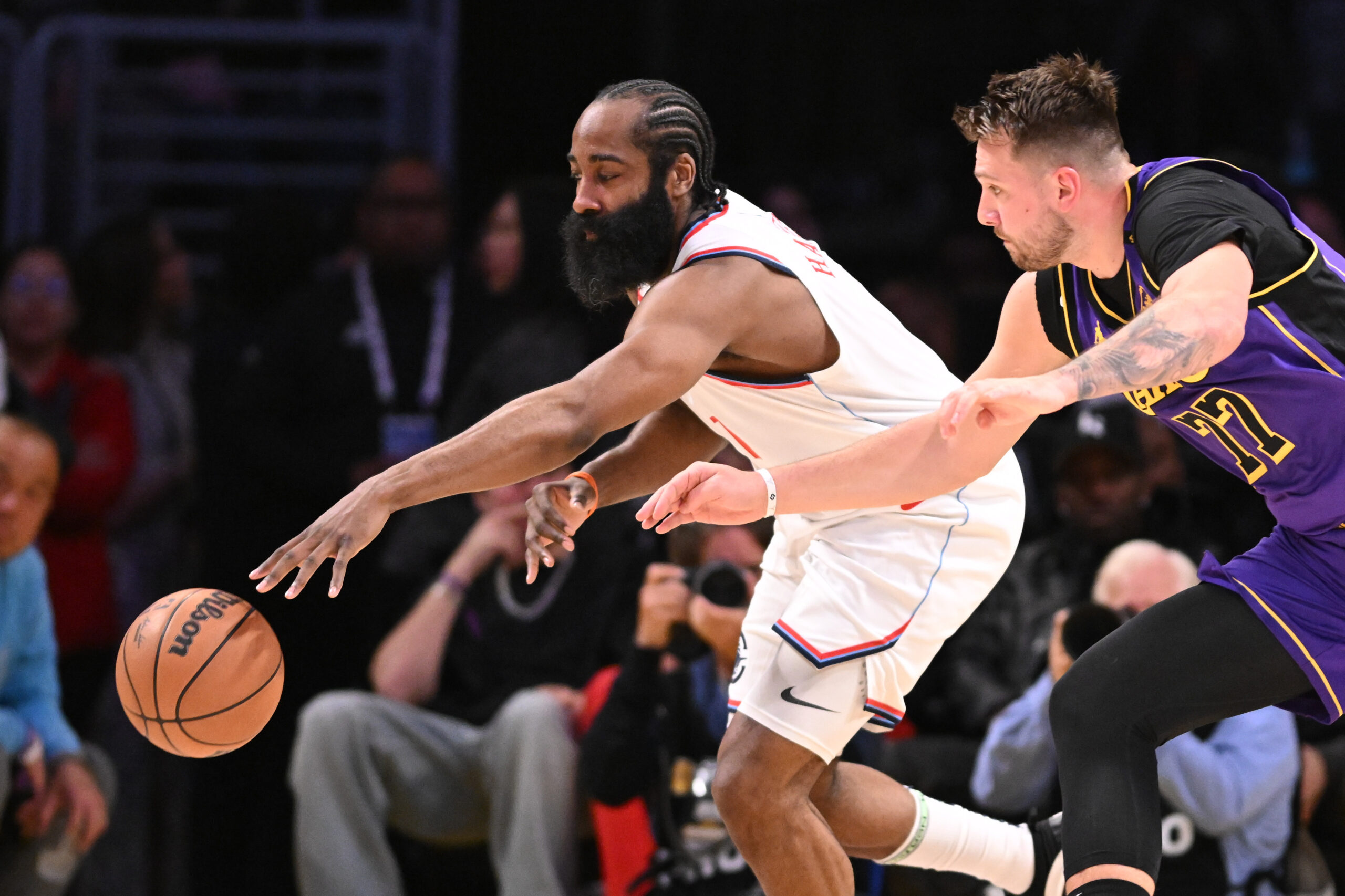 Lakers guard Luka Doncic,, right, knocks the ball away from...