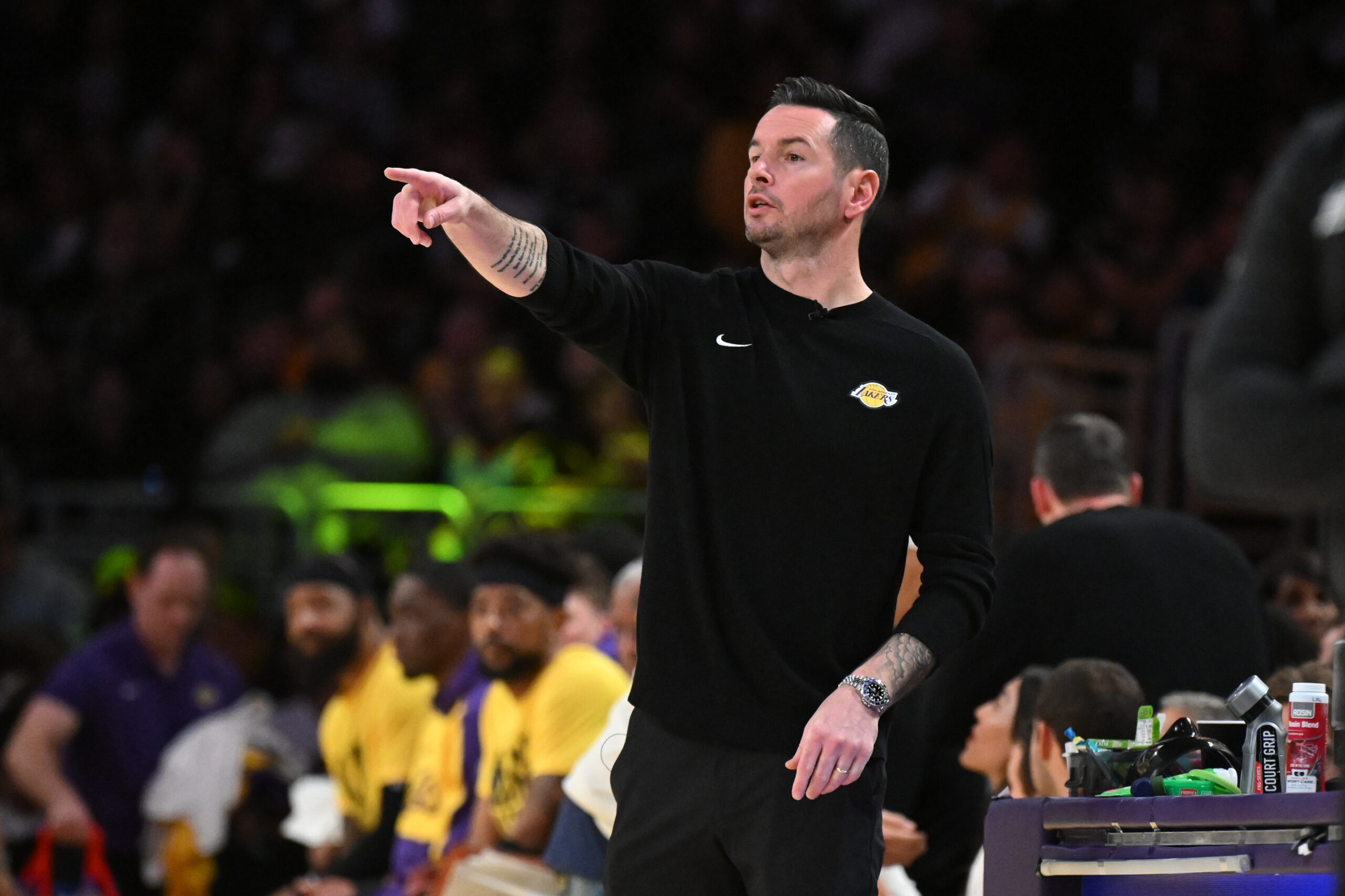 Lakers coach JJ Redick gestures from the sideline during their...