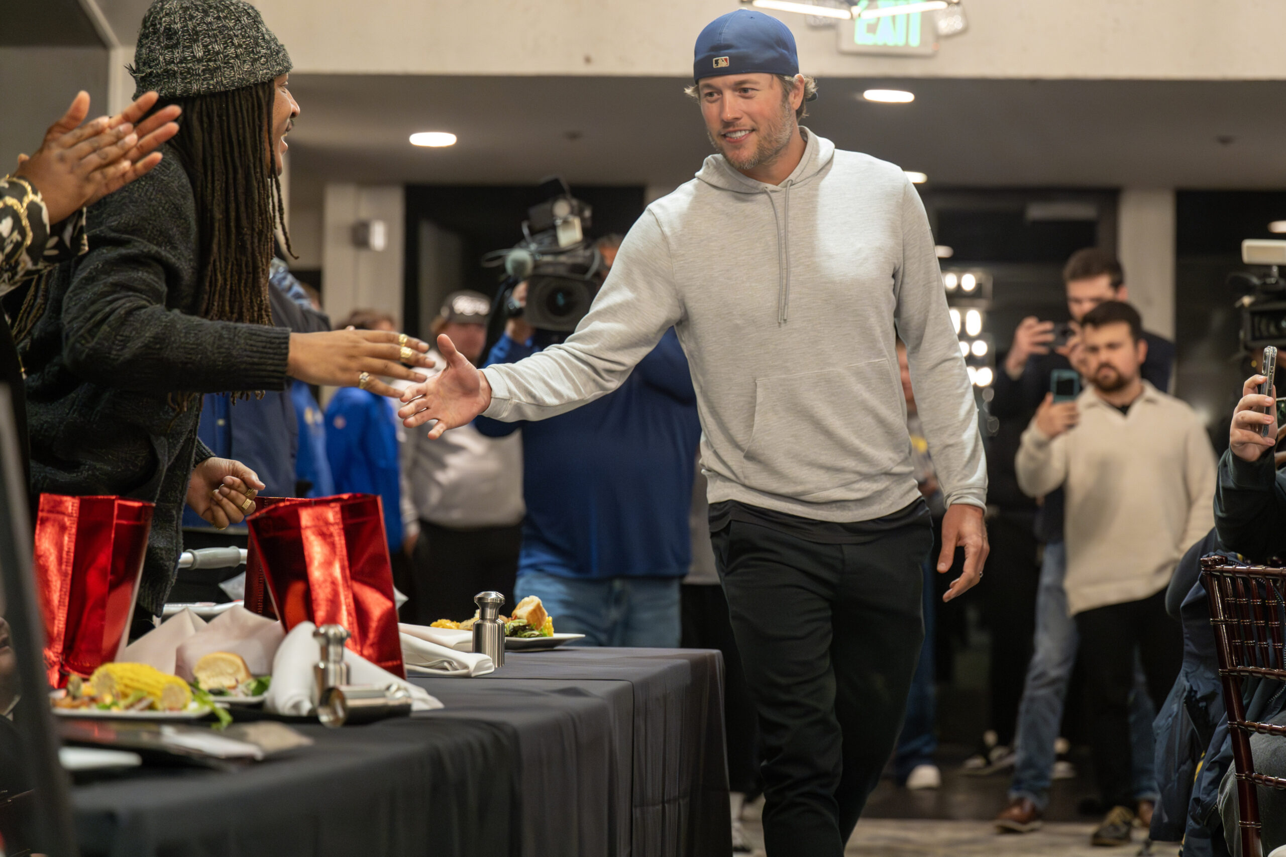 Rams quarterback Matthew Stafford shakes hands before announcing that he...