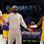 Mar 20, 2025; Los Angeles, California, USA; Los Angeles Lakers forward LeBron James (23) fives guard Bronny James (9) and center Alex Len (27) during the game against the Milwaukee Bucksduring the second half at Crypto.com Arena. Mandatory Credit: Jonathan Hui-Imagn Images