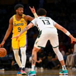 Mar 20, 2025; Los Angeles, California, USA; Los Angeles Lakers guard Bronny James (9) looks to pass against Milwaukee Bucks guard Ryan Rollins (13) during the second half at Crypto.com Arena. Mandatory Credit: Jonathan Hui-Imagn Images JJ Redick