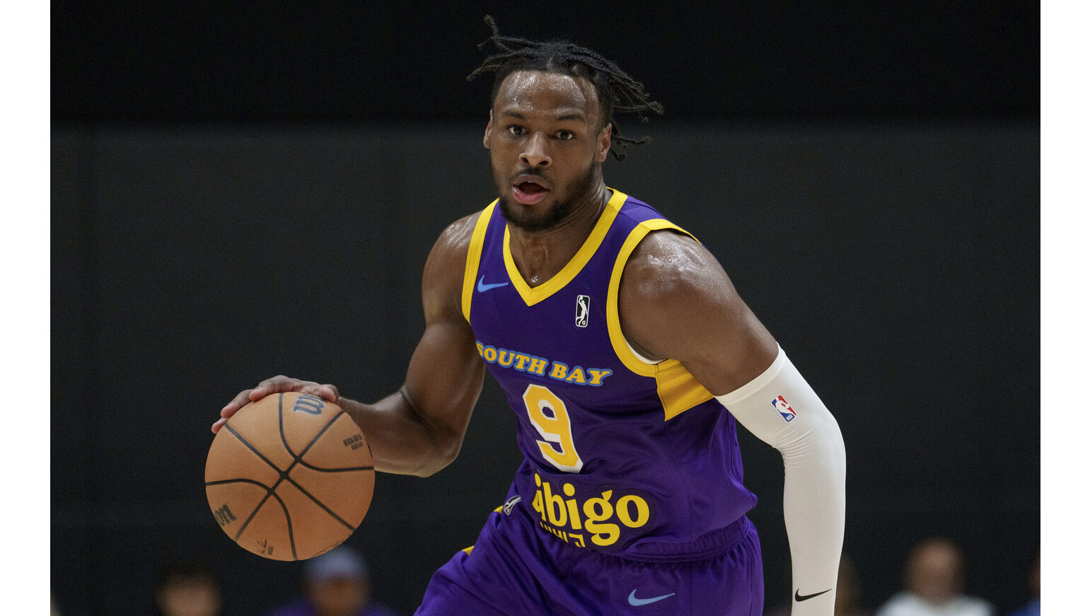 Lakers rookie Bronny James, shown handling the ball for the...