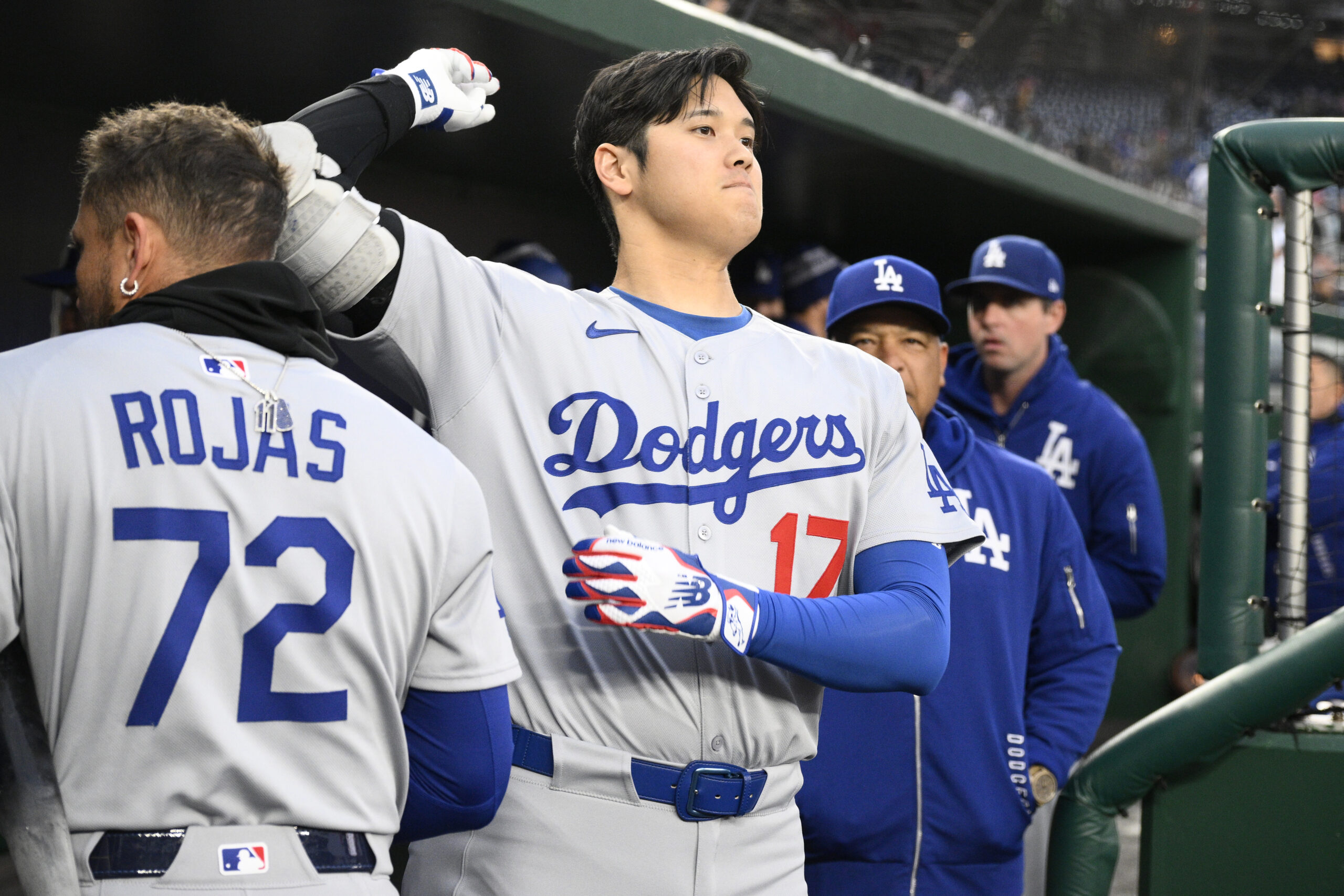 Dodgers star Shohei Ohtani gets loose before a game against...