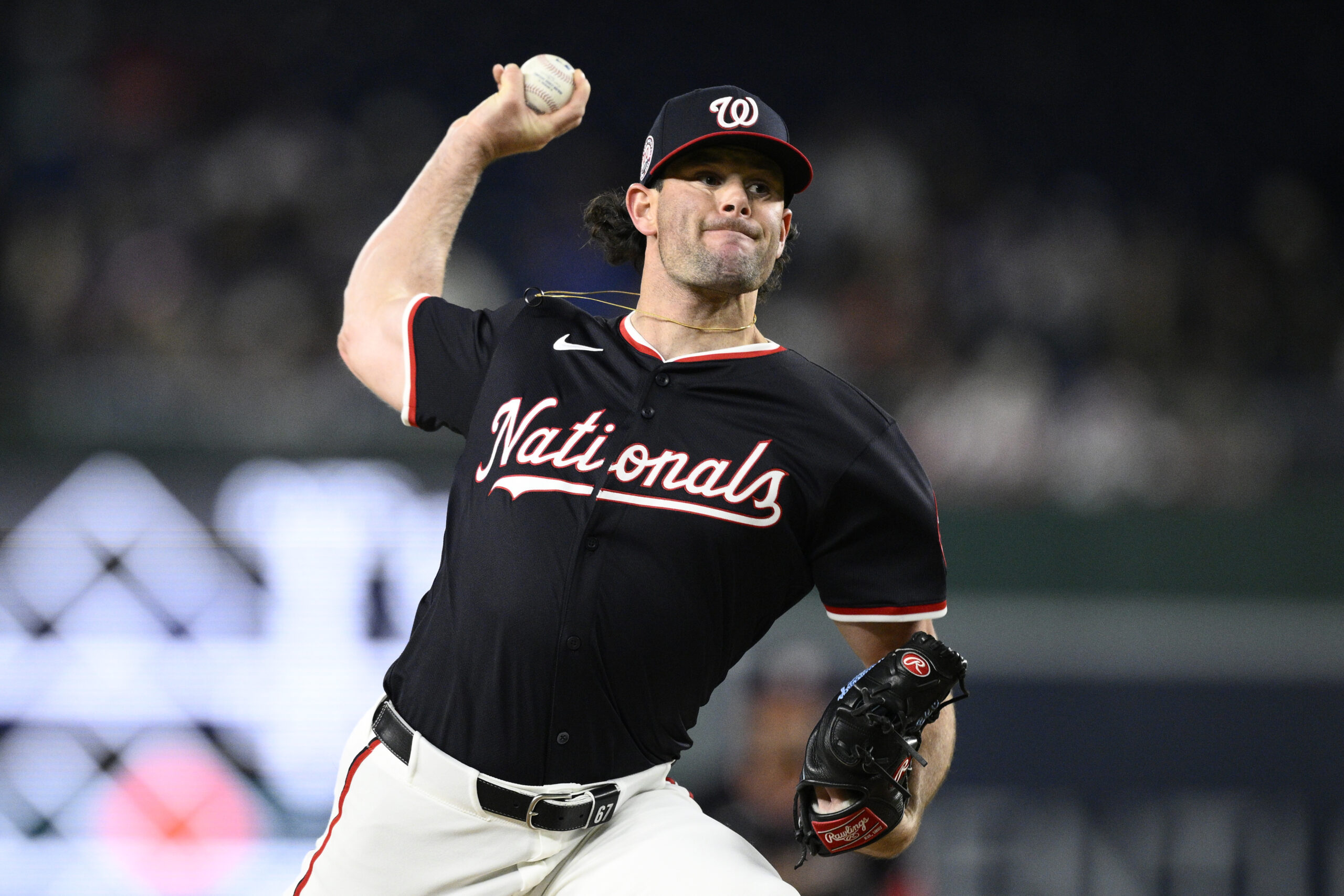 Washington Nationals relief pitcher Kyle Finnegan throws to the plate...