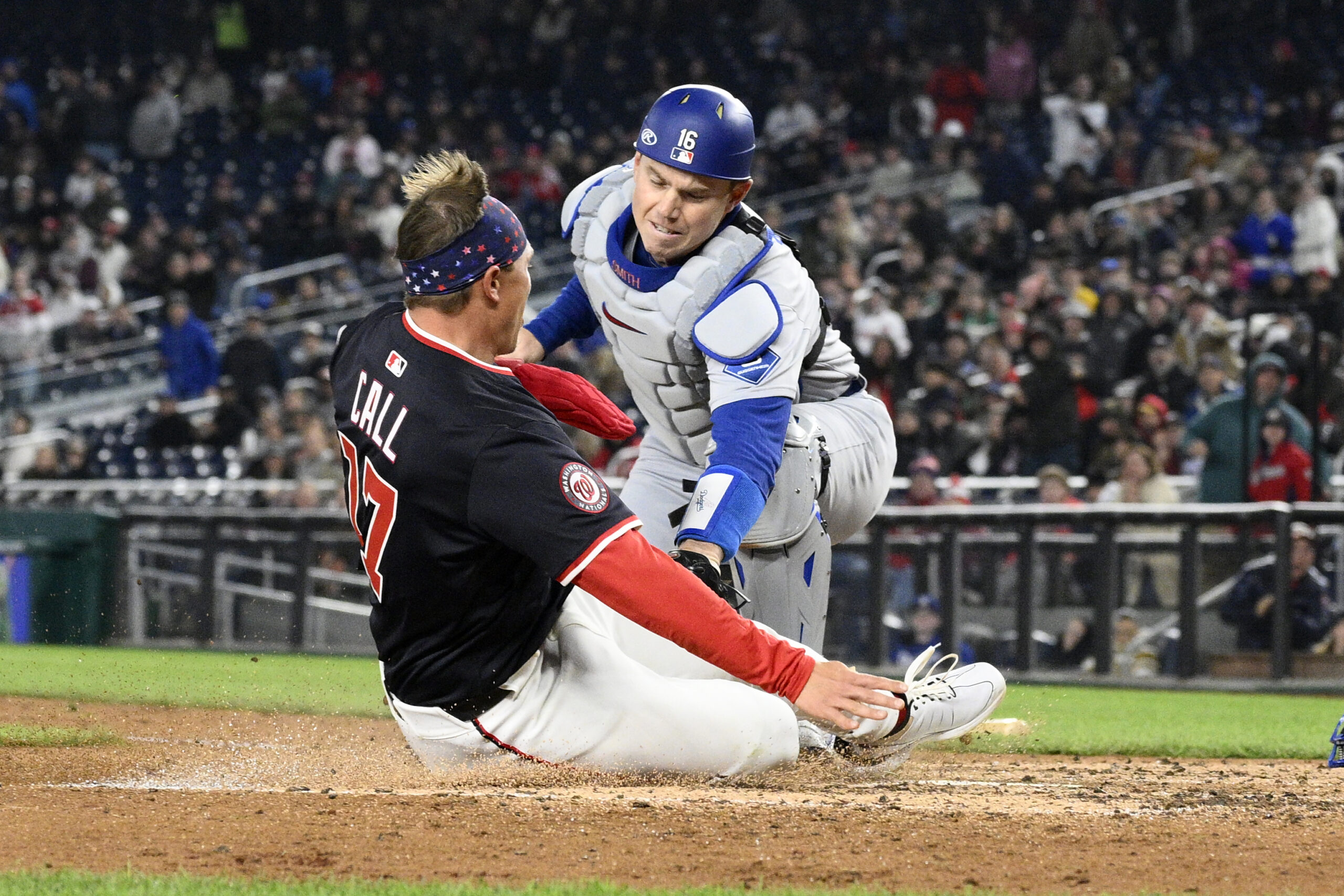 The Washington Nationals’ Alex Call, left, is tagged out at...