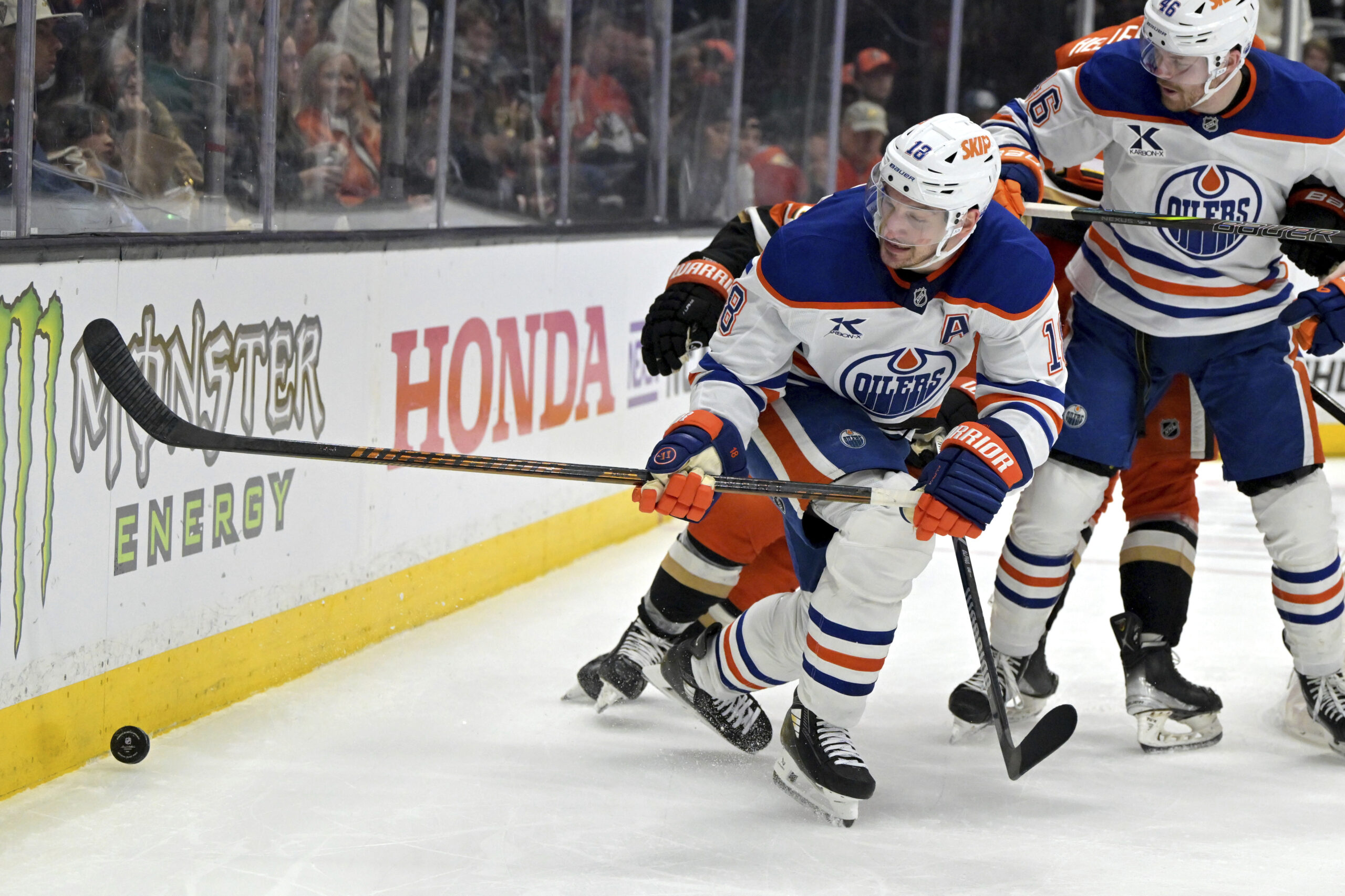 Ducks right wing Troy Terry, behind, and Edmonton Oilers left...