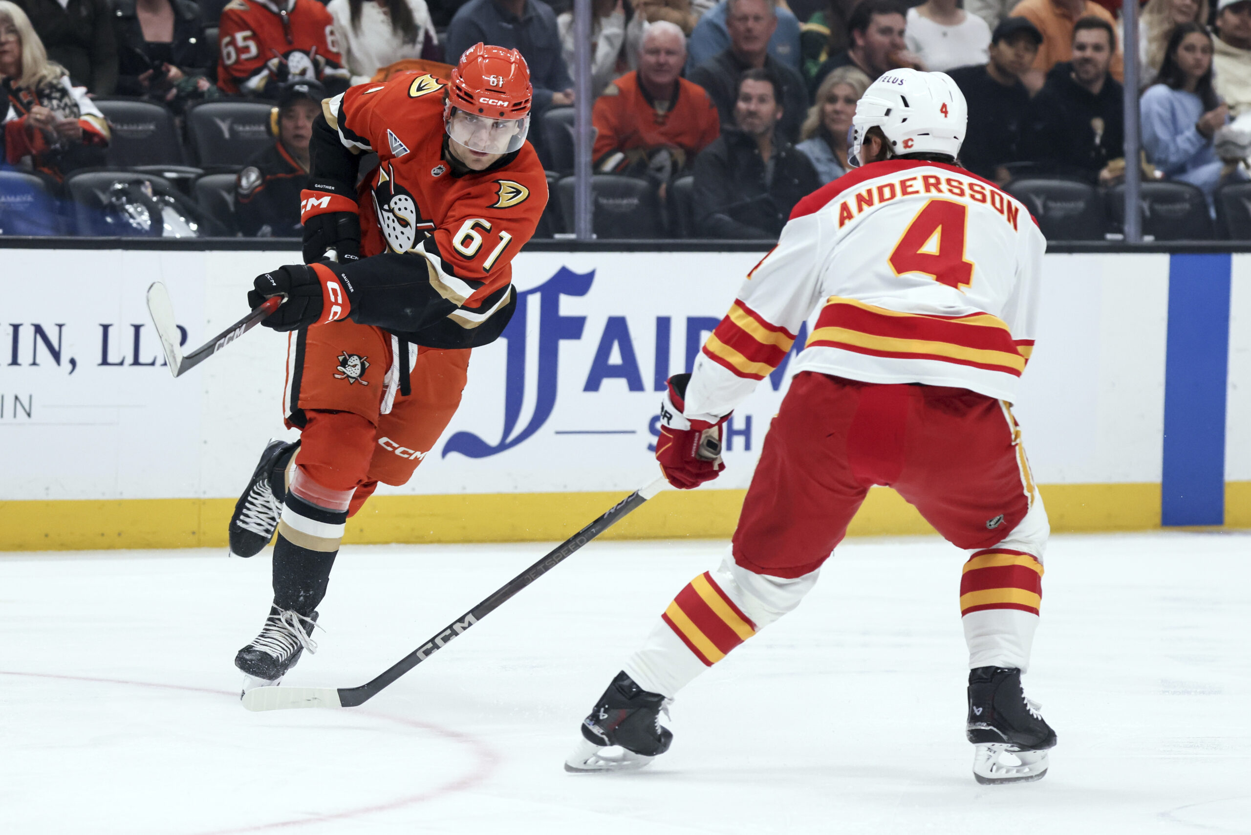Ducks winger Cutter Gauthier, left, attempts to score against Calgary...