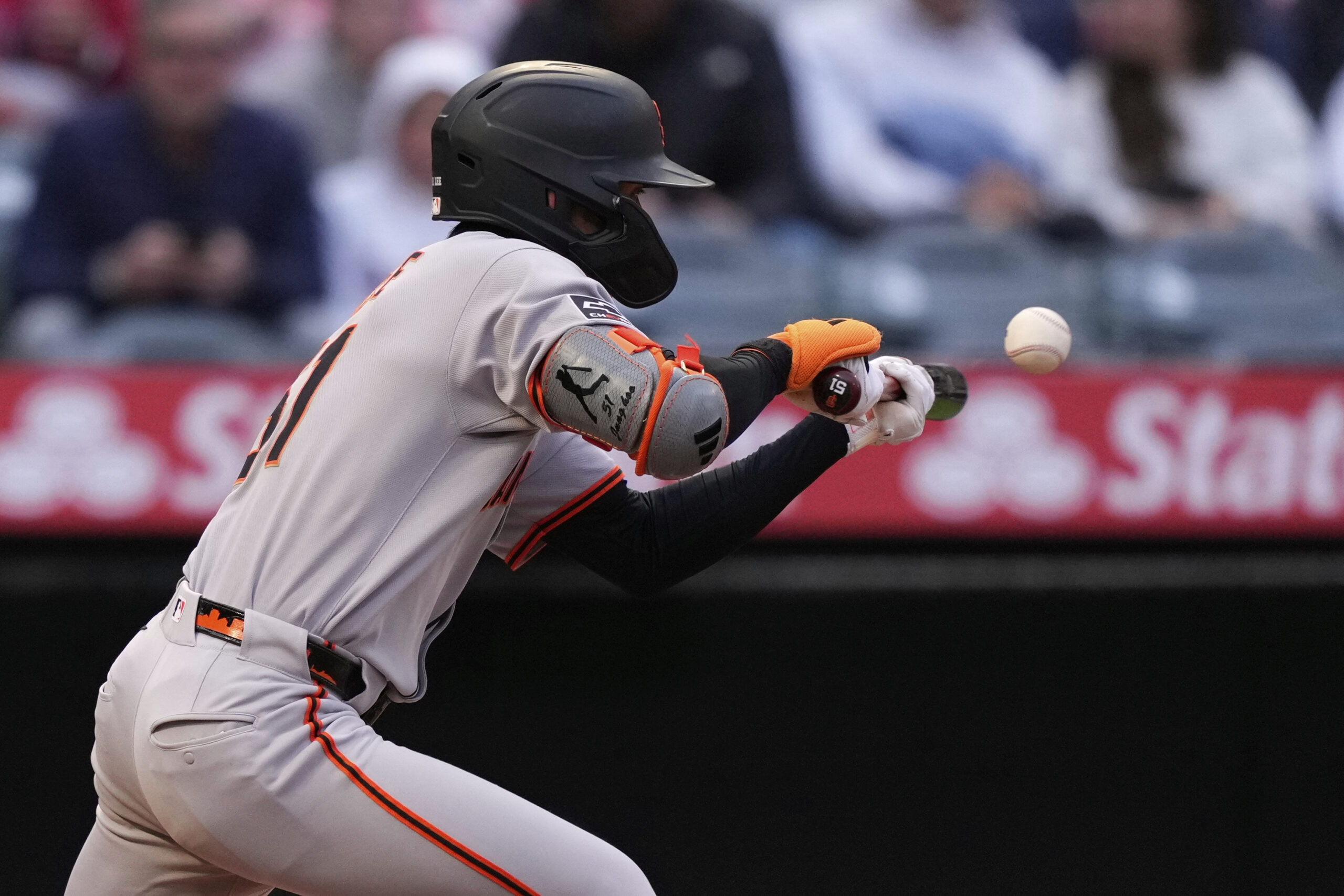 The San Francisco Giants’ Jung Hoo Lee bunts for a...