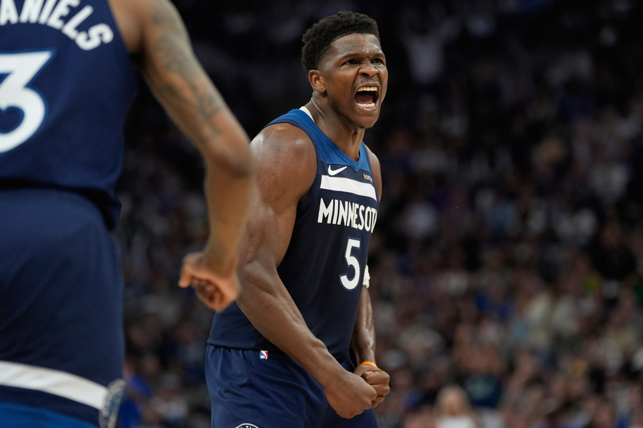 Minnesota Timberwolves guard Anthony Edwards celebrates after a shot made...
