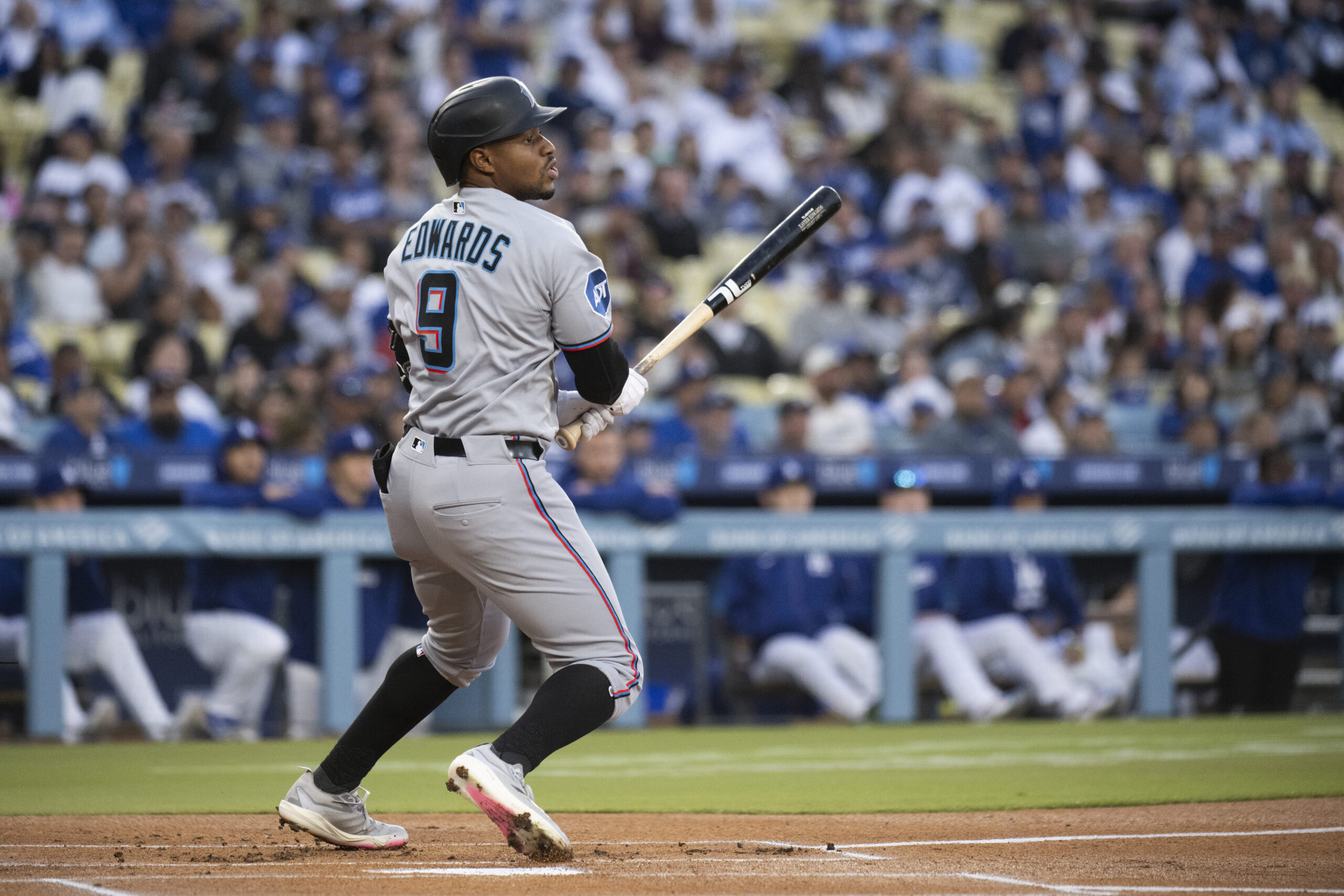 The Miami Marlins’ Xavier Edwards tracks his triple during the...