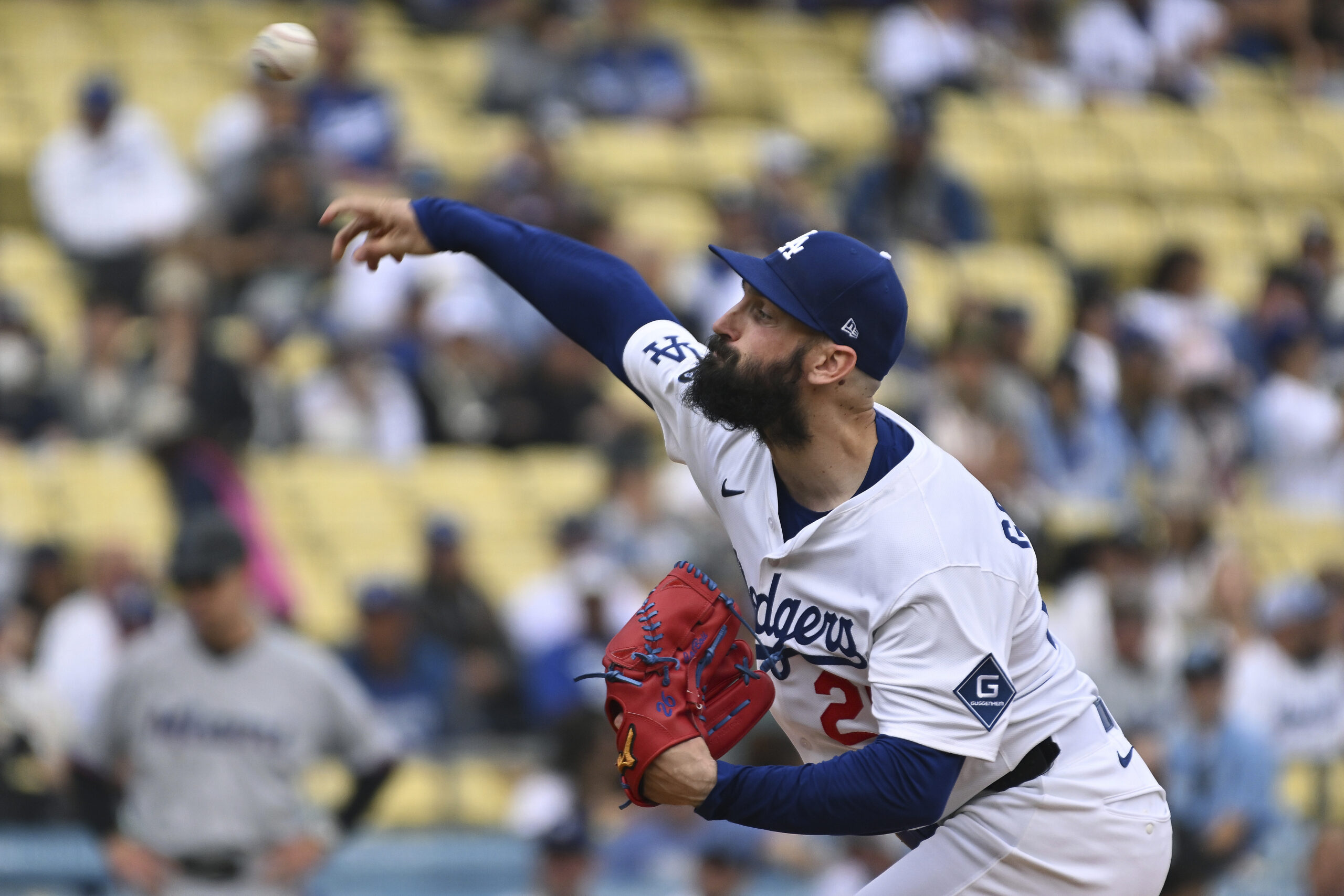 Dodgers starting pitcher Tony Gonsolin throws to the plate during...