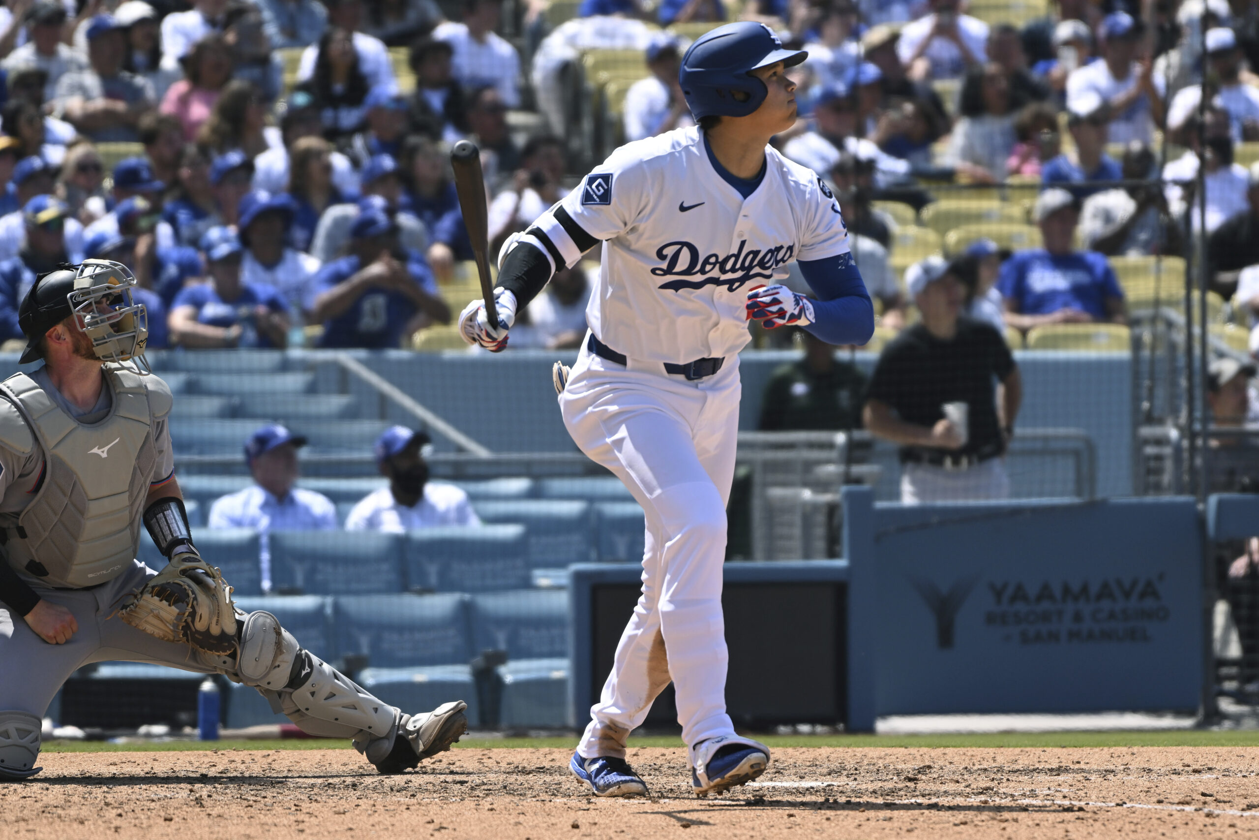 Dodgers designated hitter Shohei Ohtani hits a triple against the...