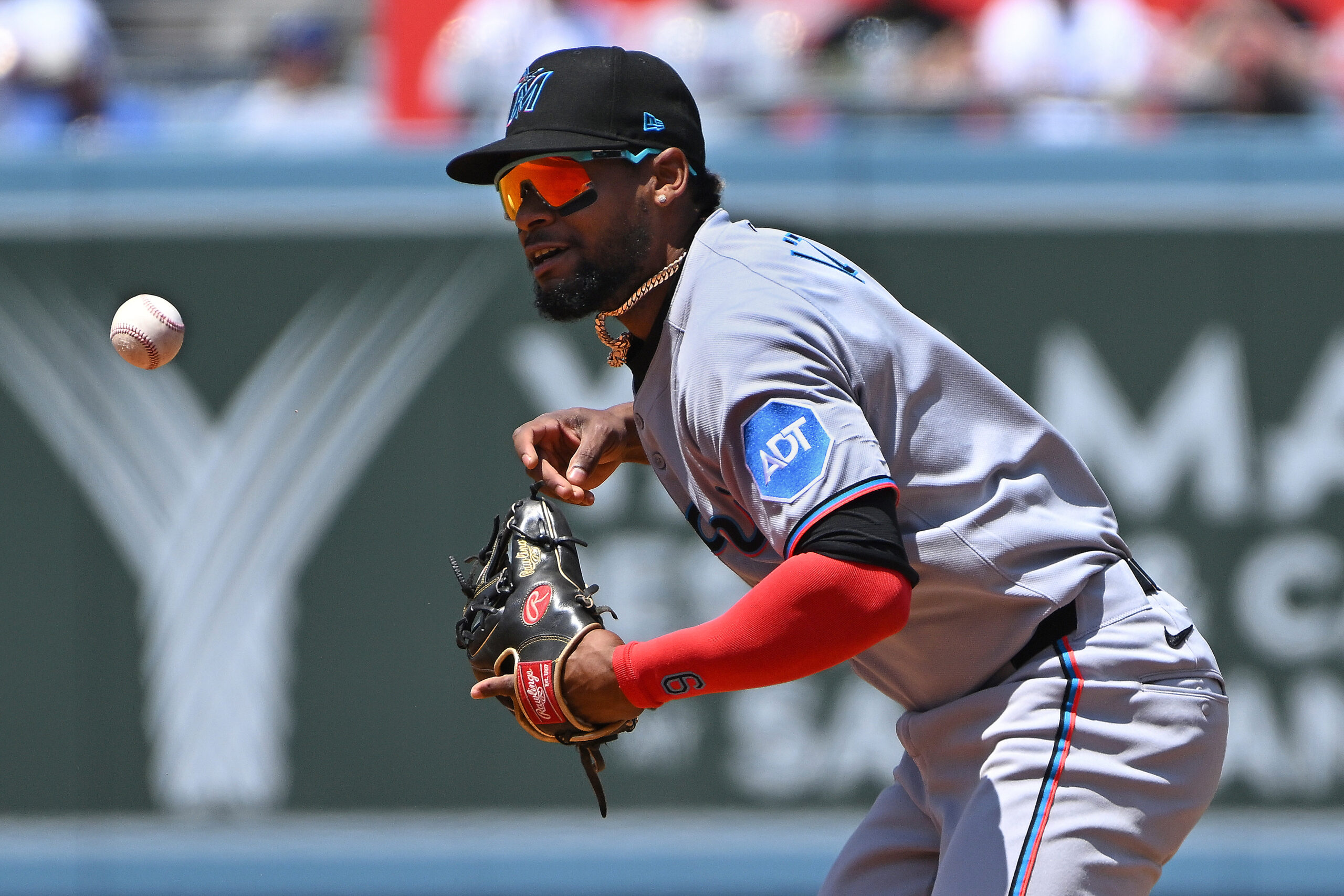 Miami Marlins second baseman Otto Lopez bobbles the baseball against...