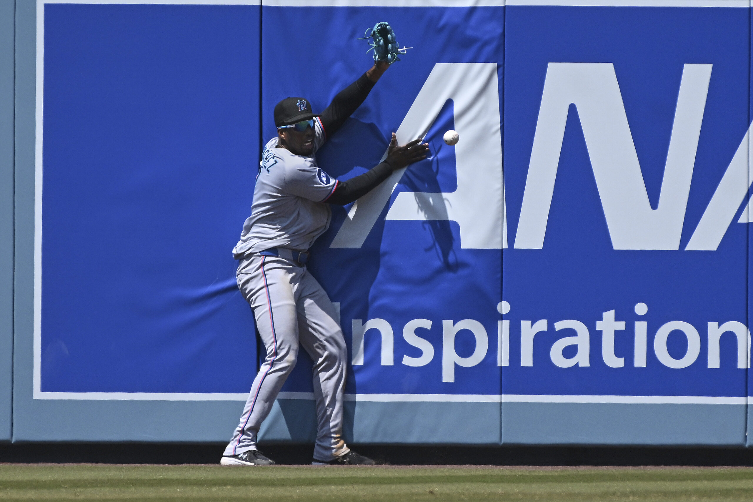 Miami Marlins outfielder Jesús Sánchez can’t make the catch on...