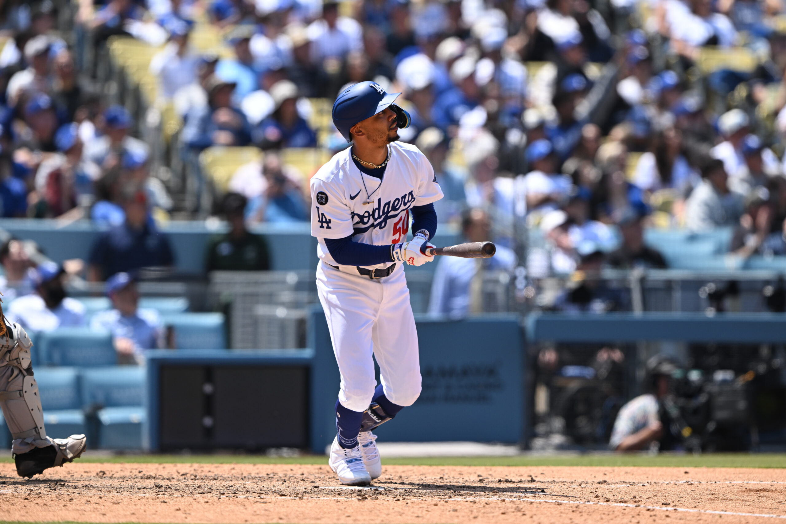The Dodgers’ Mookie Betts hits a two-run triple during the...