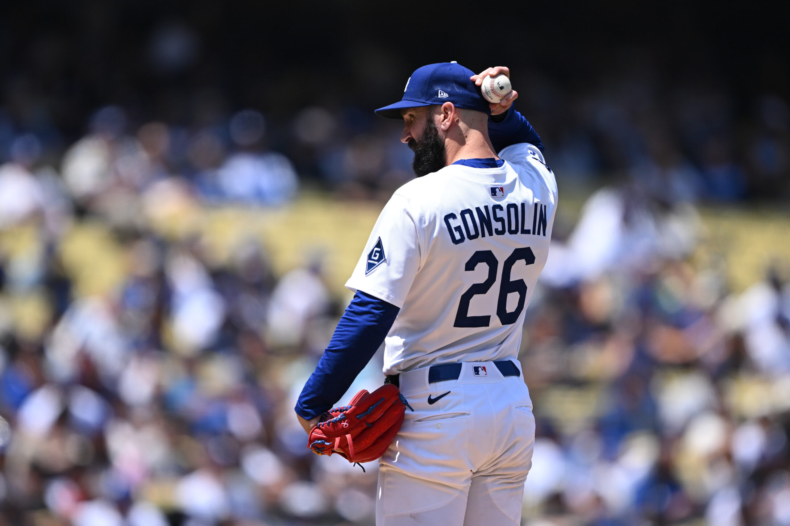 Dodgers starting pitcher Tony Gonsolin looks toward home plate between...