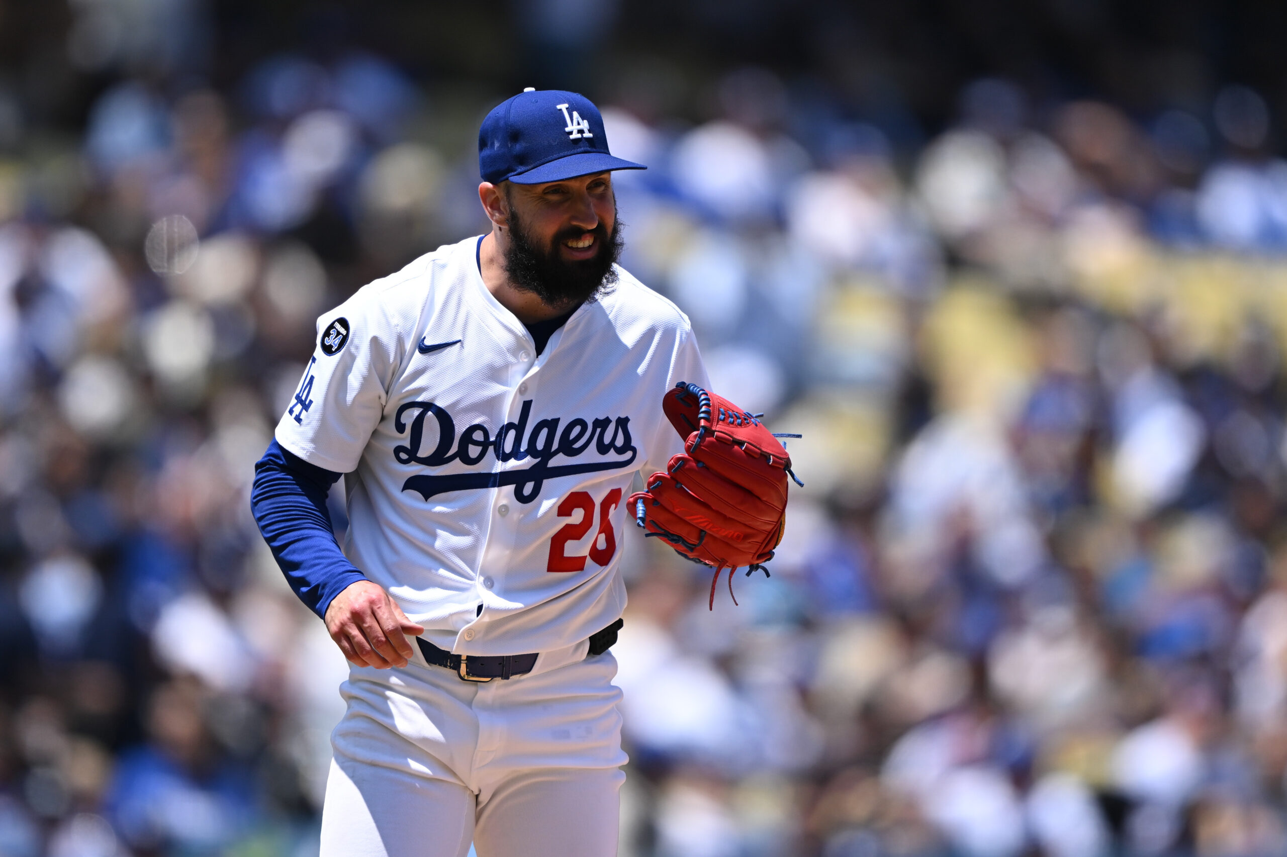 Dodgers starting pitcher Tony Gonsolin shows some emotion during their...