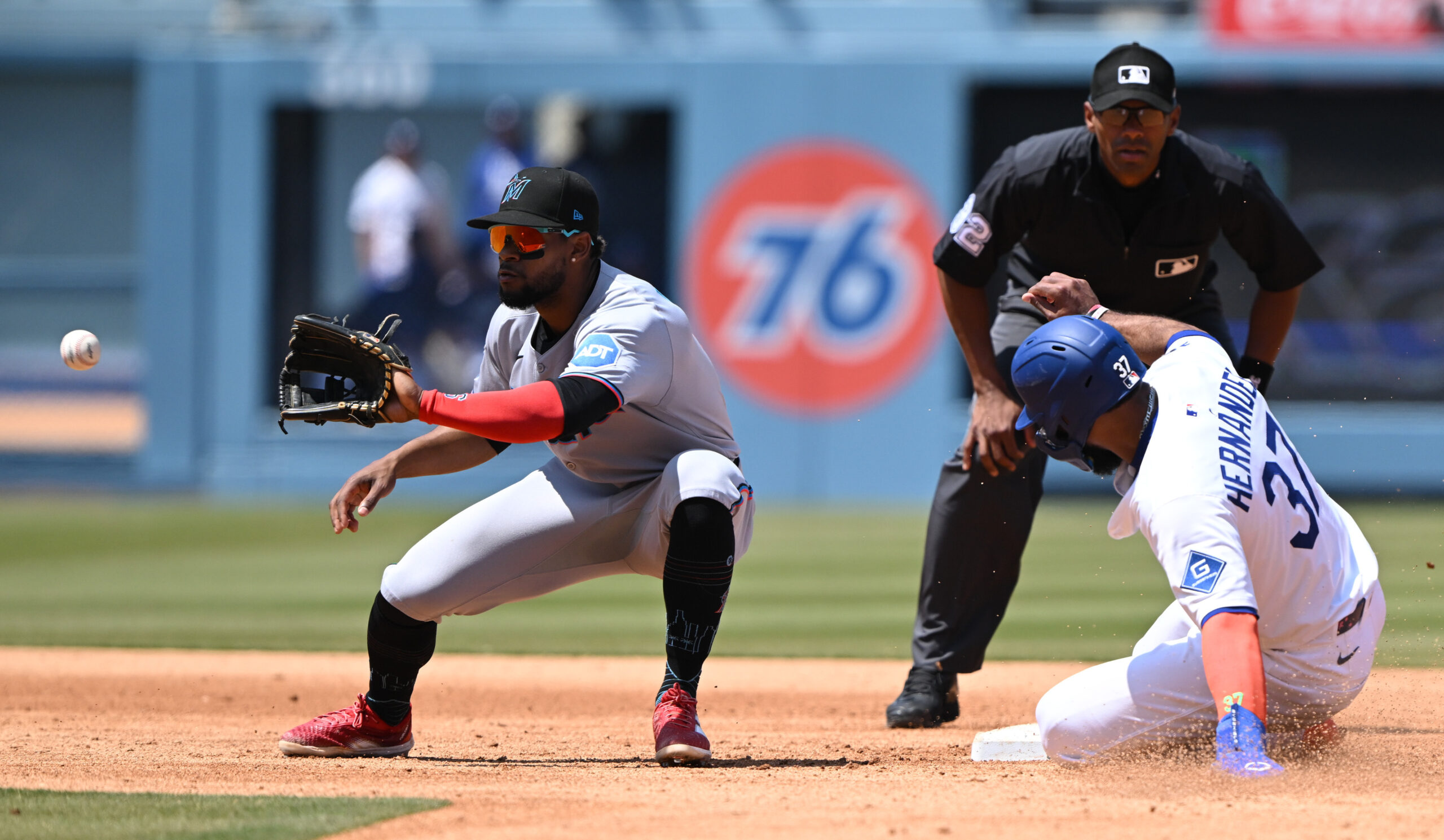 The Dodgers’ Teoscar Hernandez is safe at second base as...