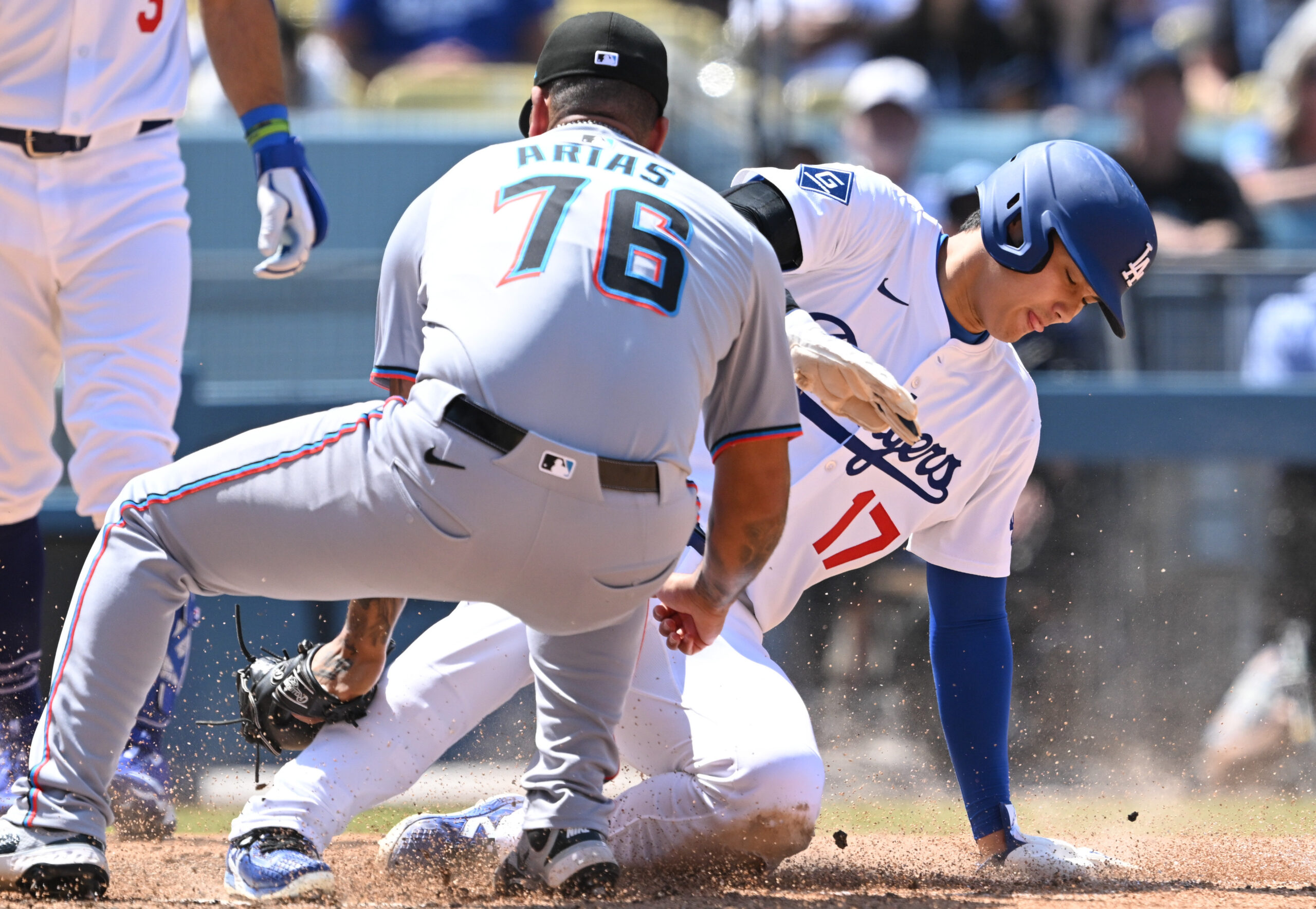 Dodgers star Shohei Ohtani slides home to score as Miami...