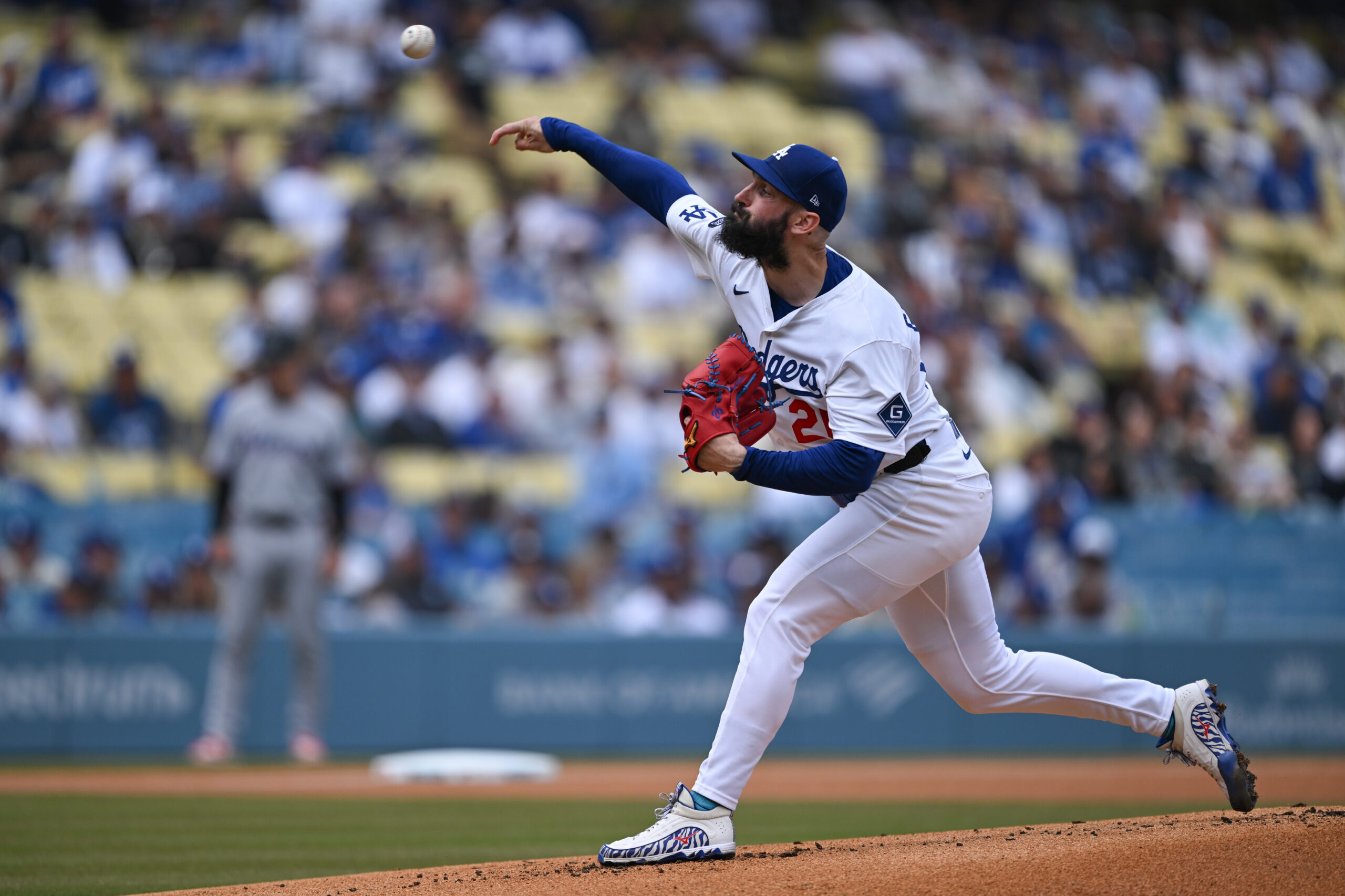 Dodgers starting pitcher Tony Gonsolin throws to the plate during...