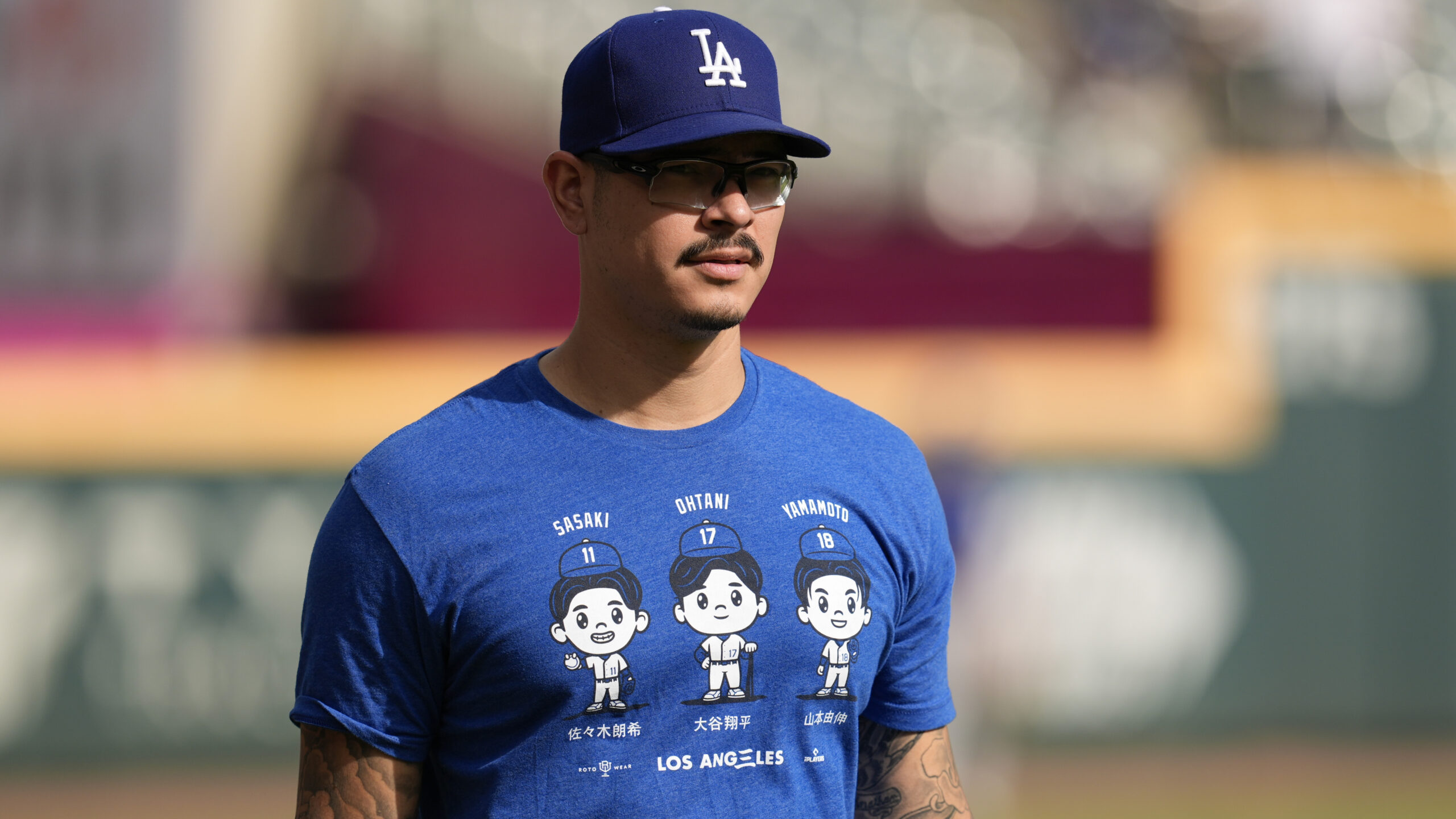 Dodgers relief pitcher Anthony Banda warms up before game against...
