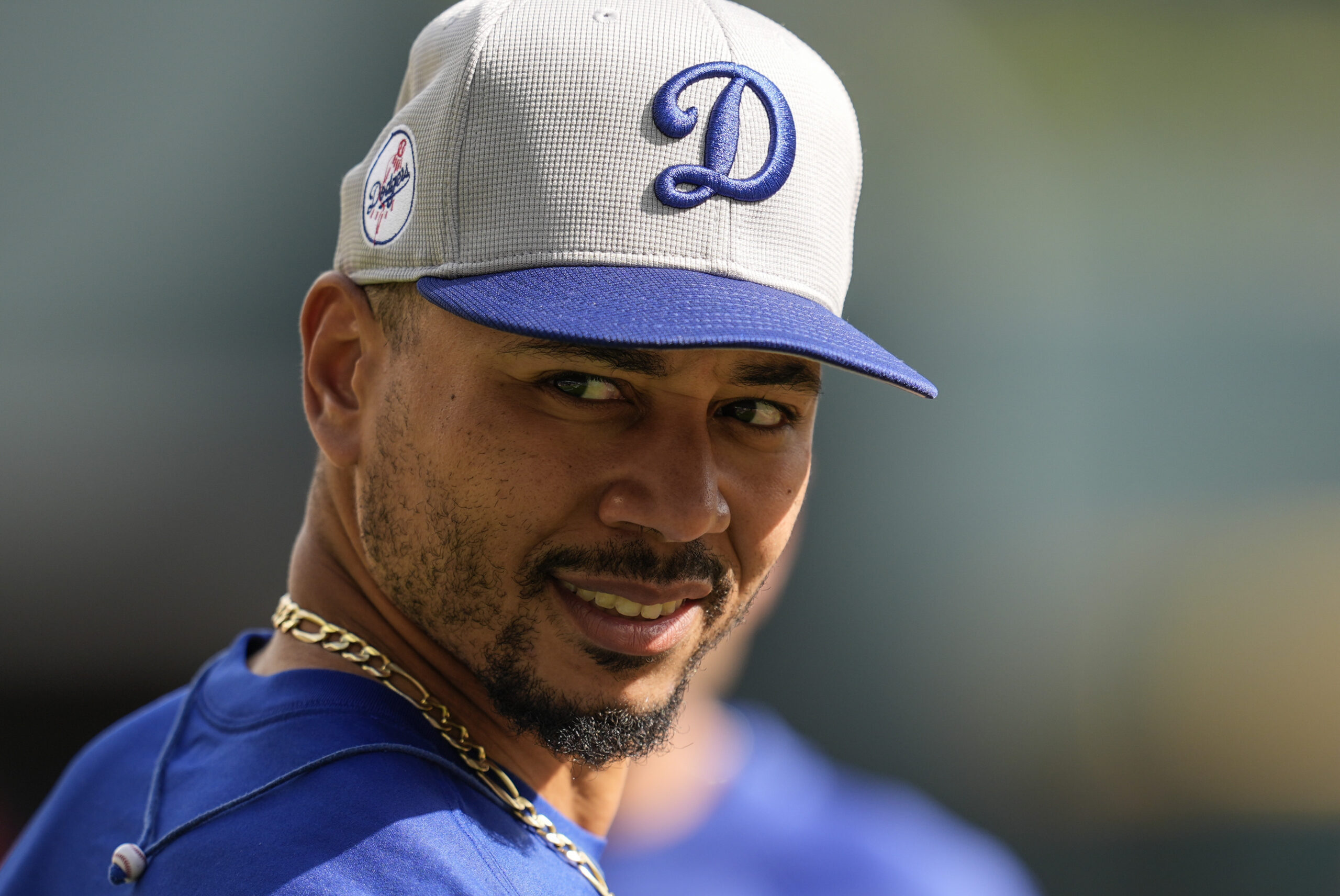 Dodgers shortstop Mookie Betts warms up before game against the...
