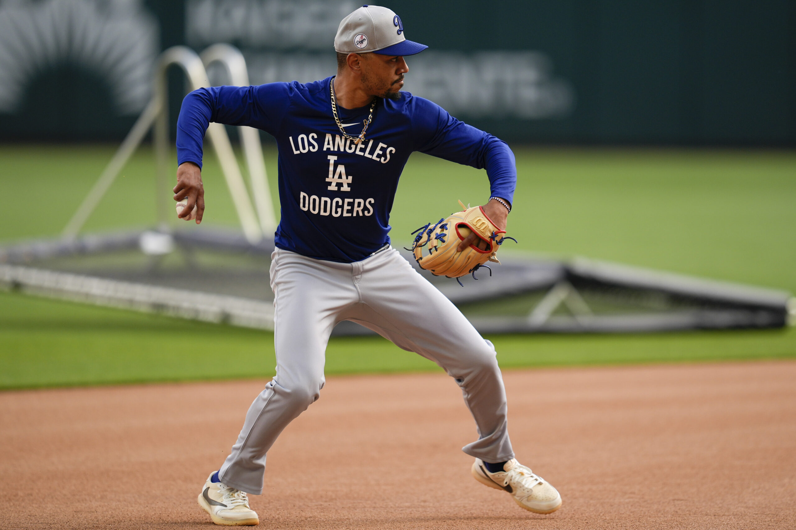 Dodgers shortstop Mookie Betts warms up before game against the...