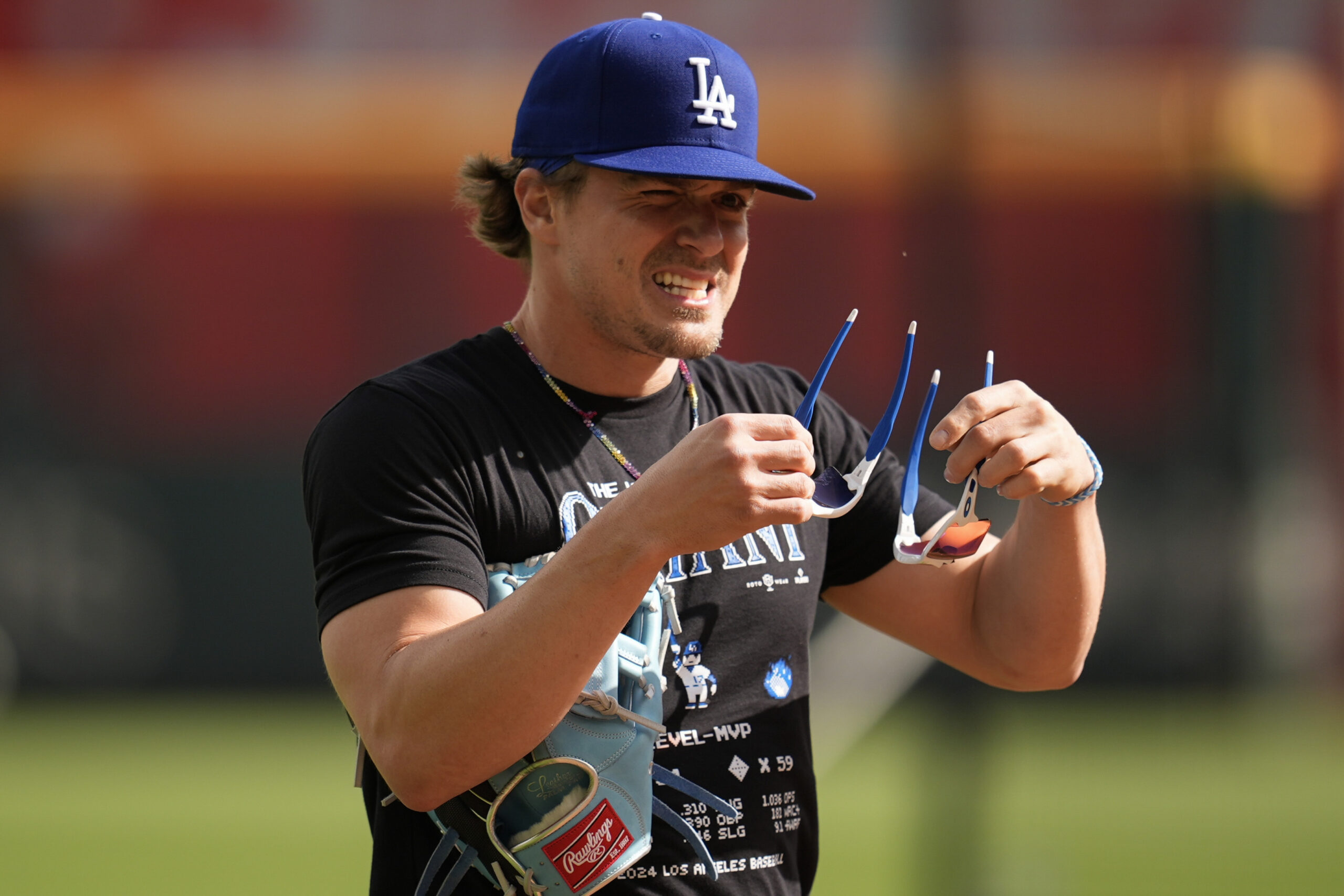 Dodgers utility man Kike Hernandez warms up before game against...