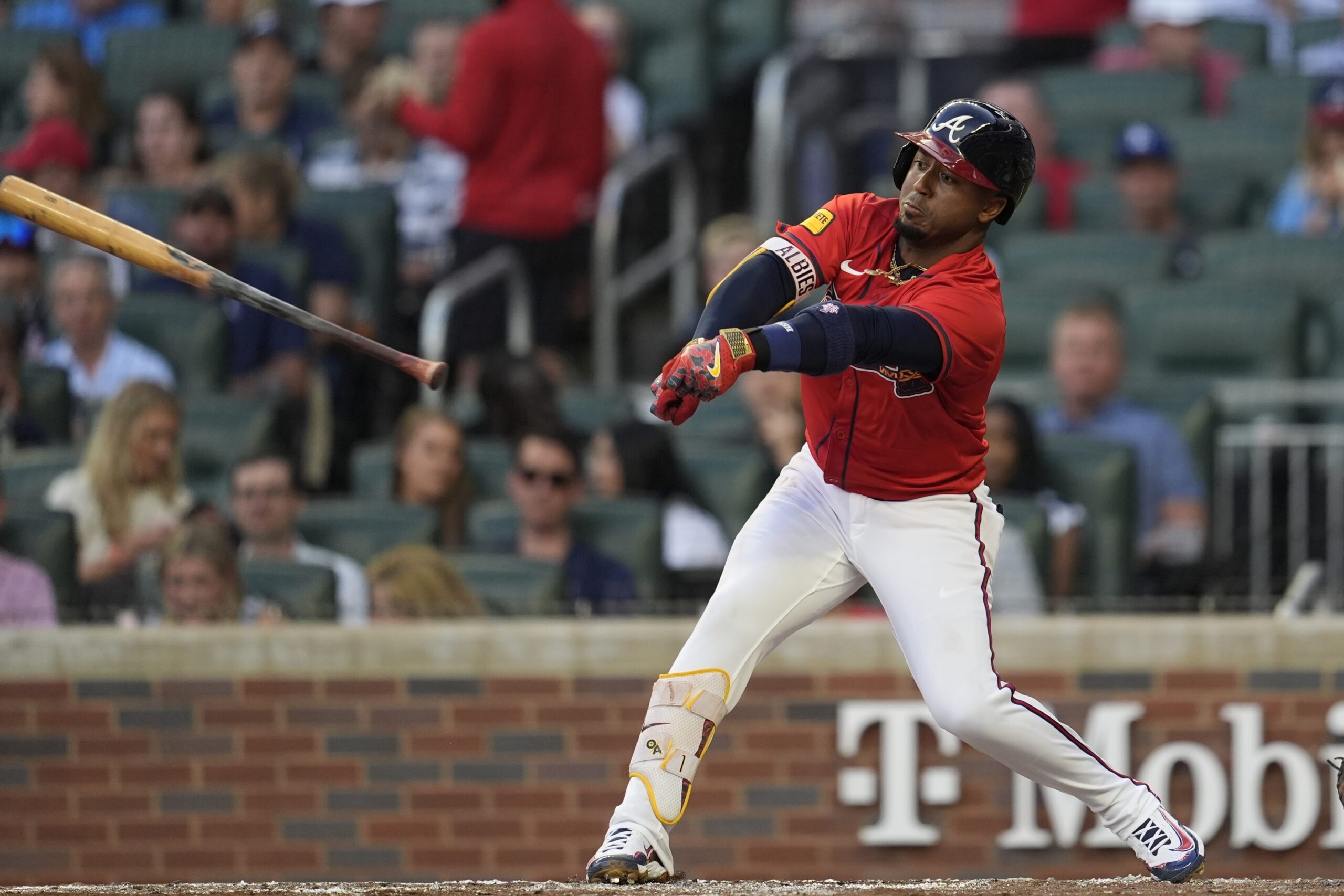The Atlanta Braves’ Ozzie Albies loses his bat after striking...
