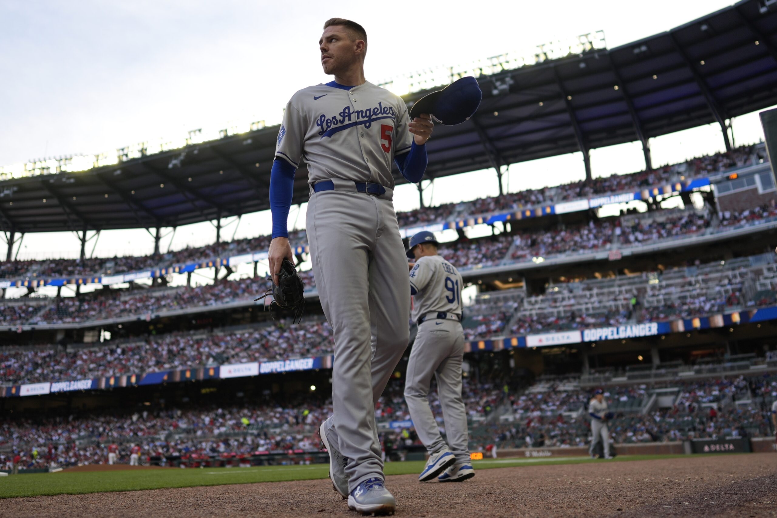 Dodgers first baseman Freddie Freeman walks off the field in...