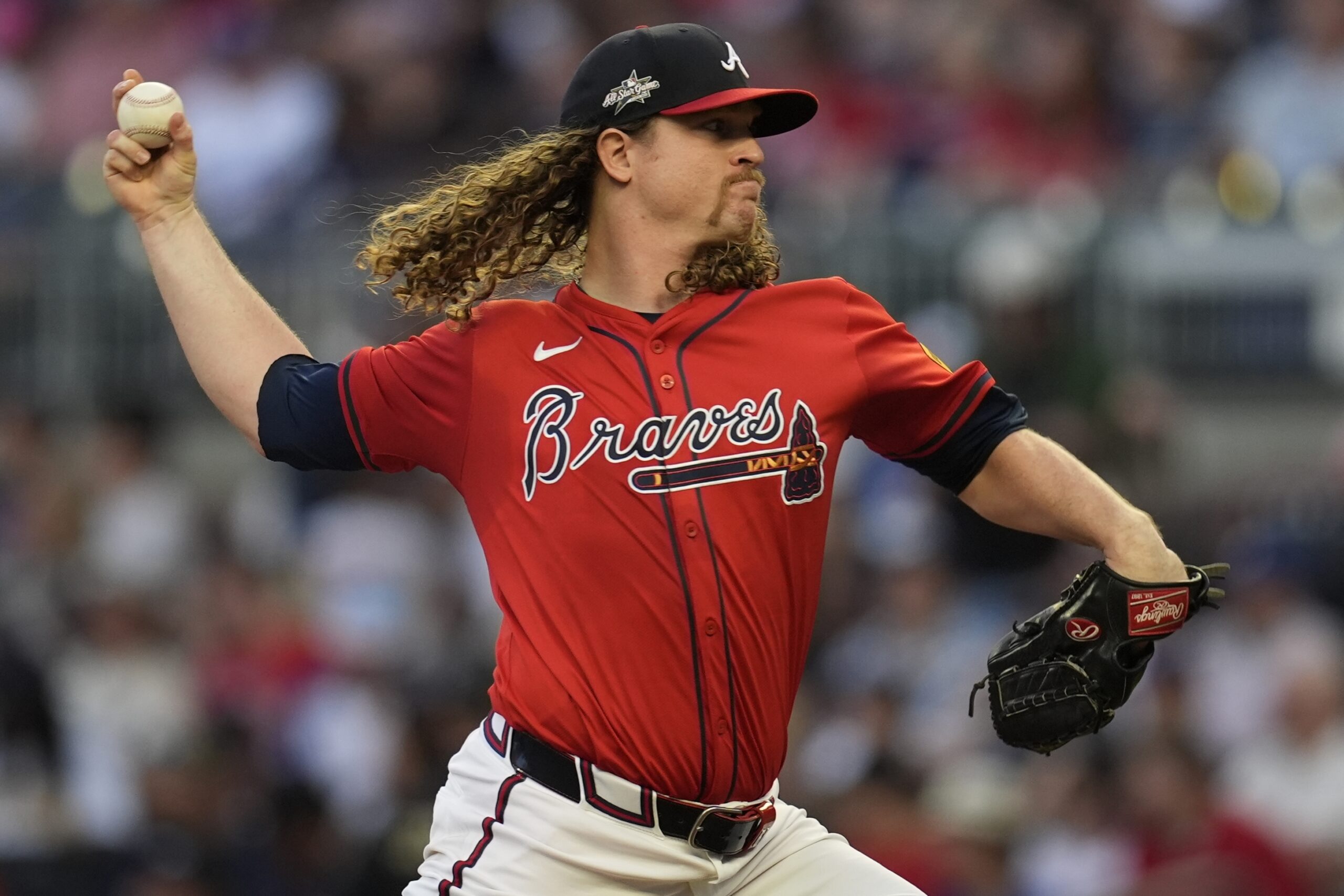 Atlanta Braves starting pitcher Grant Holmes throws to the plate...