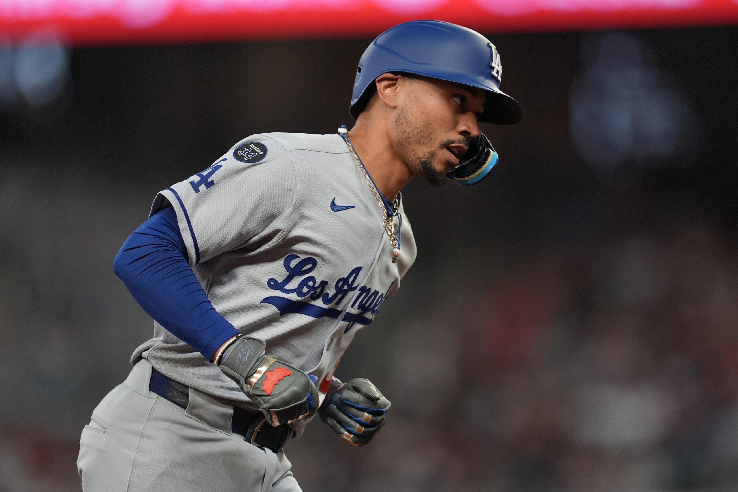 Dodgers star Mookie Betts celebrates his solo homer as he...