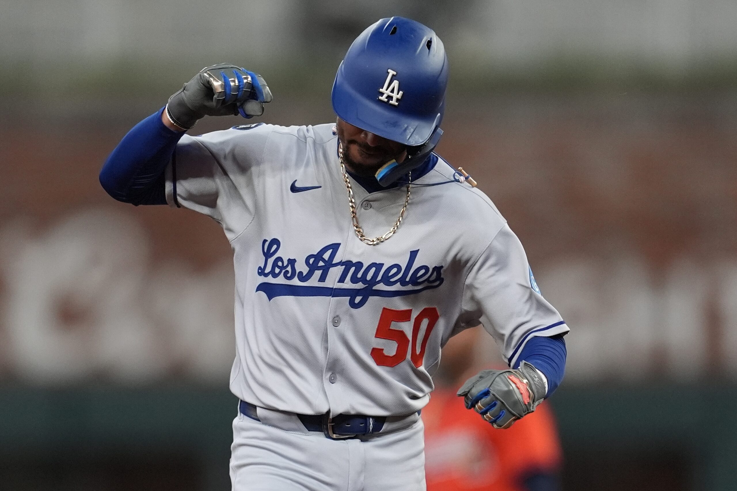 Dodgers star Mookie Betts celebrates his solo homer as he...
