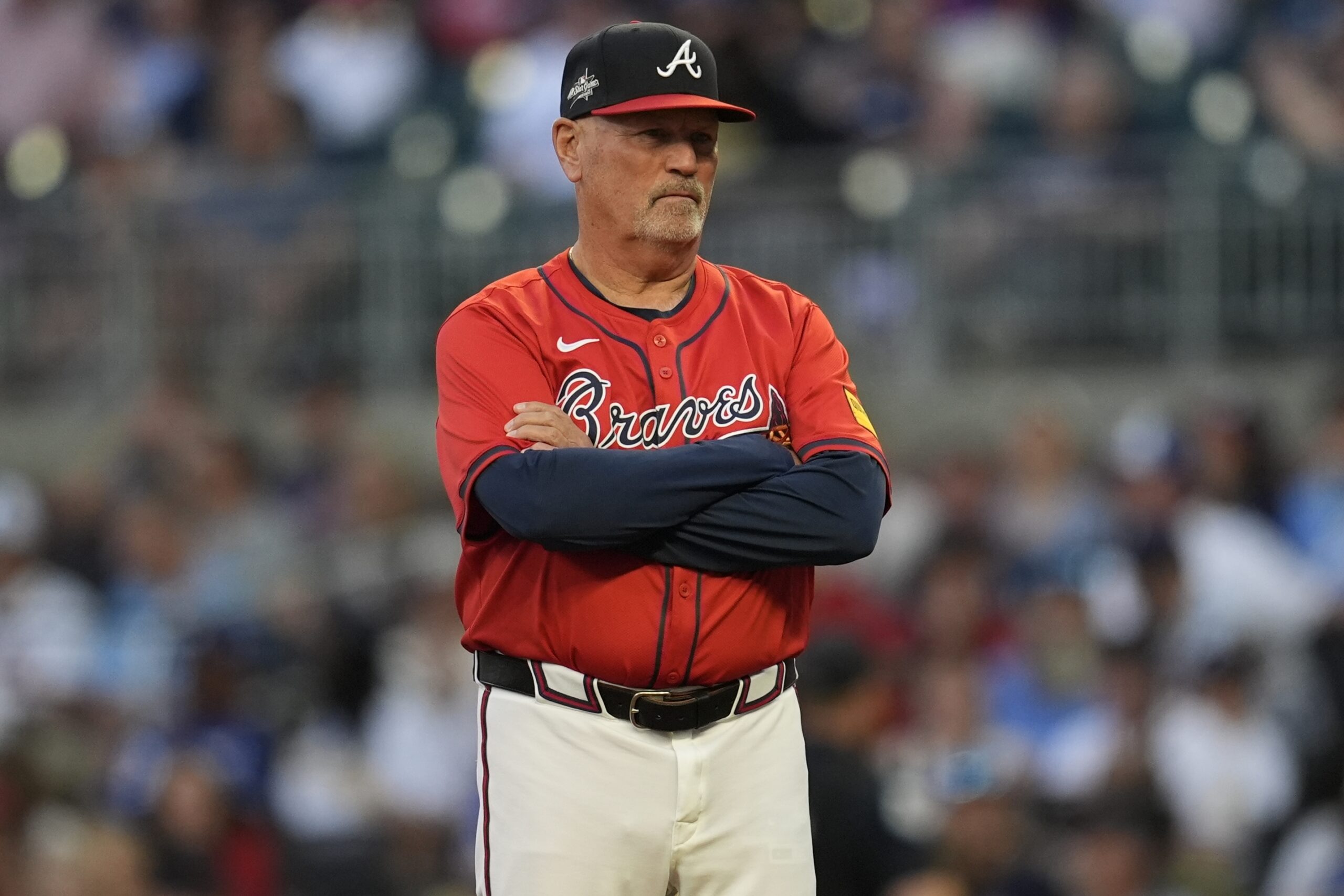 Atlanta Braves manager Brian Snitker stands near the mound in...